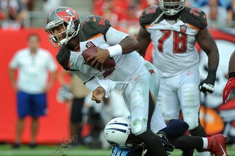 TAMPA, FL - SEPTEMBER 13: Quarterback Jameis Winston #3 of the Tampa Bay Buccaneers is sacked by outside linebacker Derrick Morgan #91 of the Tennessee Titans in the fourth quarter at Raymond James Stadium on September 13, 2015 in Tampa, Florida. (Photo b