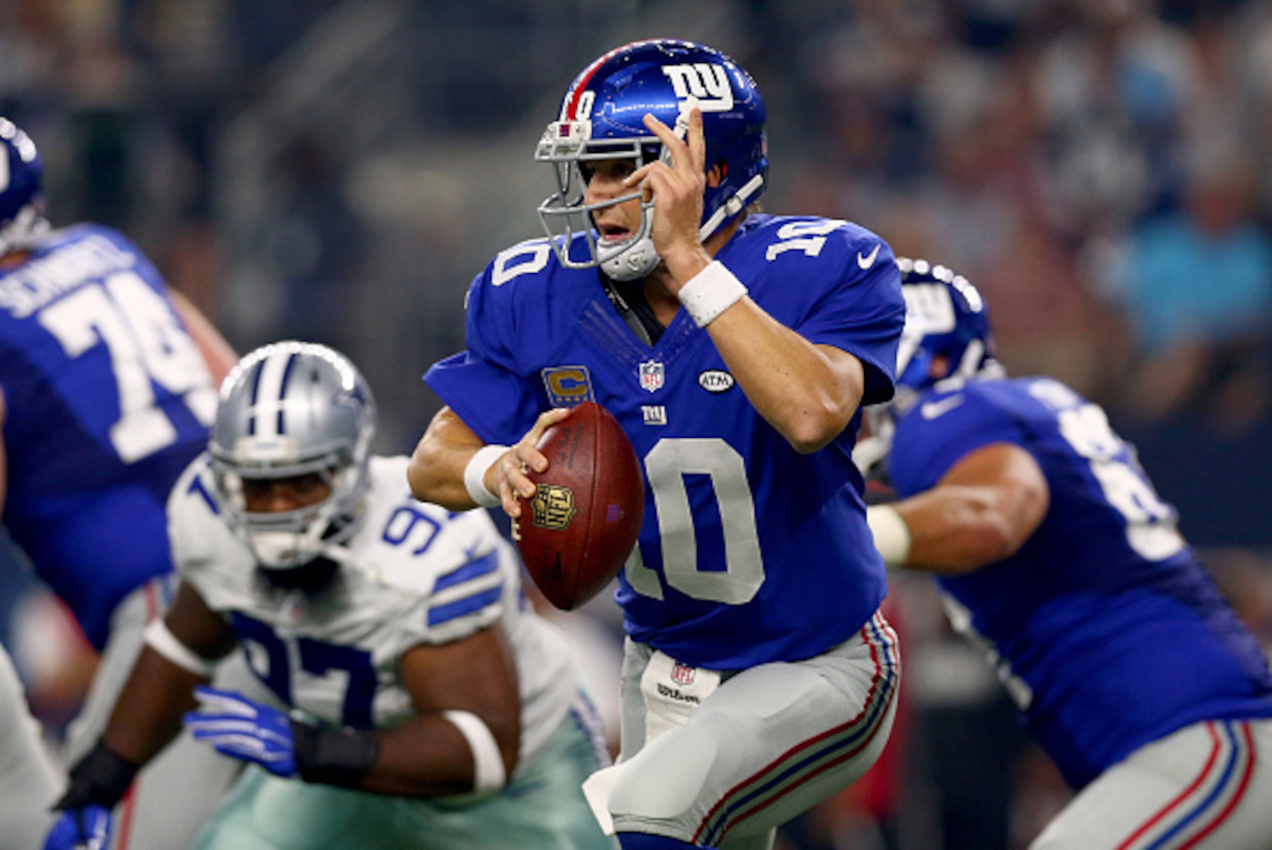 ARLINGTON, TX - SEPTEMBER 13: Eli Manning #10 of the New York Giants looks down field as Terrell McClain #97 of the Dallas Cowboys pursues at AT&T Stadium on September 13, 2015 in Arlington, Texas. (Photo by Tom Pennington/Getty Images) ARLINGTON, TX - SEPTEMBER 13: Eli Manning #10 of the New York Giants looks down field as Terrell McClain #97 of the Dallas Cowboys pursues at AT&T Stadium on September 13, 2015 in Arlington, Texas. (Photo by Tom Pennington/Getty Images)