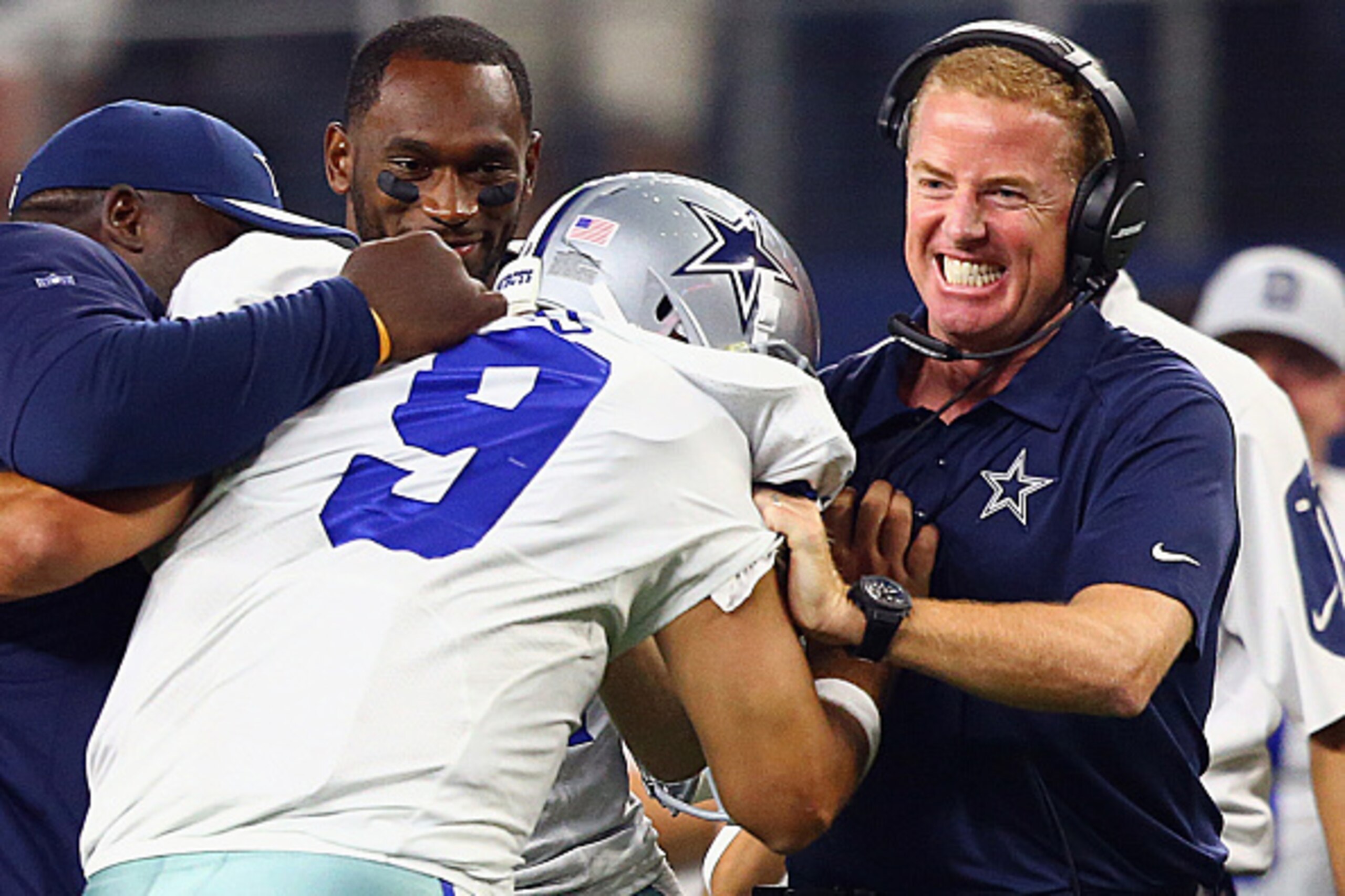 ARLINGTON, TX - SEPTEMBER 13:  Tony Romo #9 celebrates the game winning touchdown with head coach Jason Garrett of the Dallas Cowboys in the fourth quarter against the New York Giants at AT&T Stadium on September 13, 2015 in Arlington, Texas.  (Photo by R
