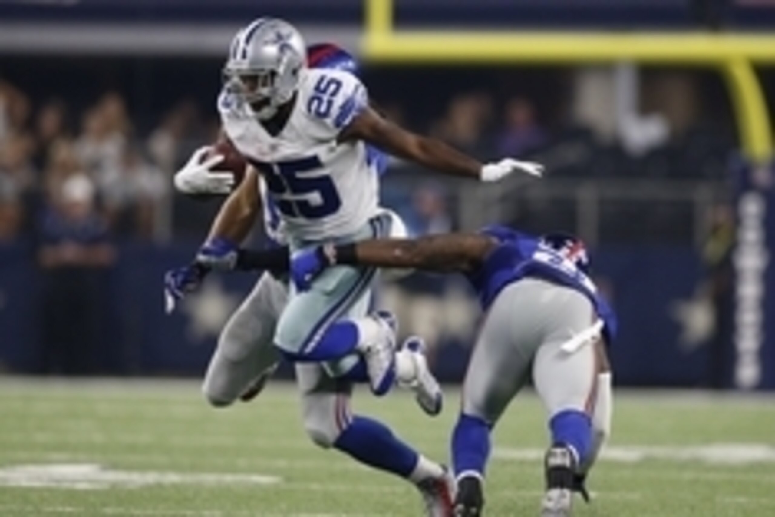 Sep 13, 2015; Arlington, TX, USA; Dallas Cowboys running back Lance Dunbar (25) runs with the ball after a reception late in the fourth quarter against New York Giants safety Landon Collins (21) and linebacker Uani Unga (47) at AT&T Stadium. Mandatory Cre