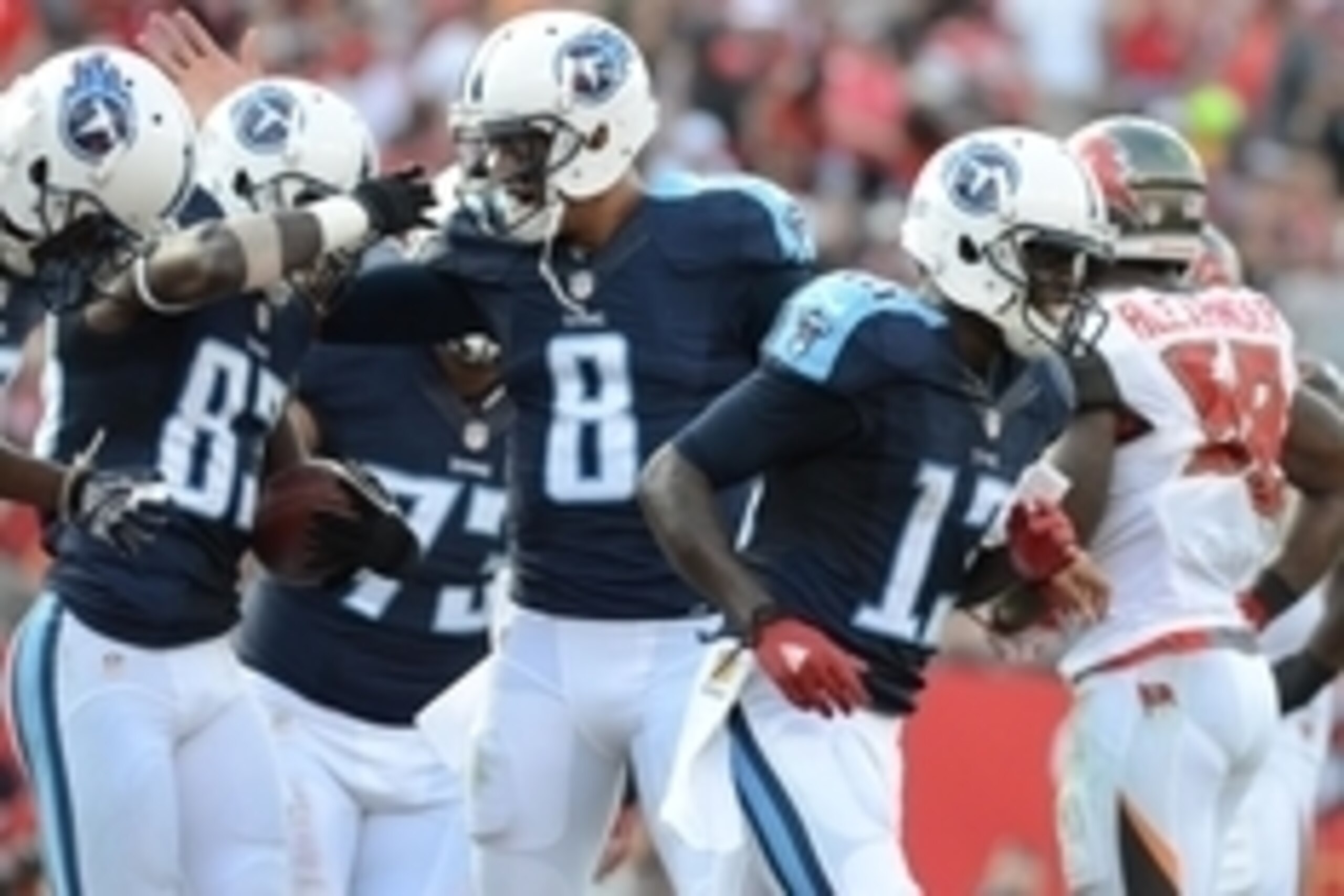 Sep 13, 2015; Tampa, FL, USA; Tennessee Titans quarterback Marcus Mariota (8) celebrates with Delanie Walker (83) after a touchdown   in the first half against the Tampa Bay Buccaneers at Raymond James Stadium. The Titans defeated the Buccaneers 42-14. Ma