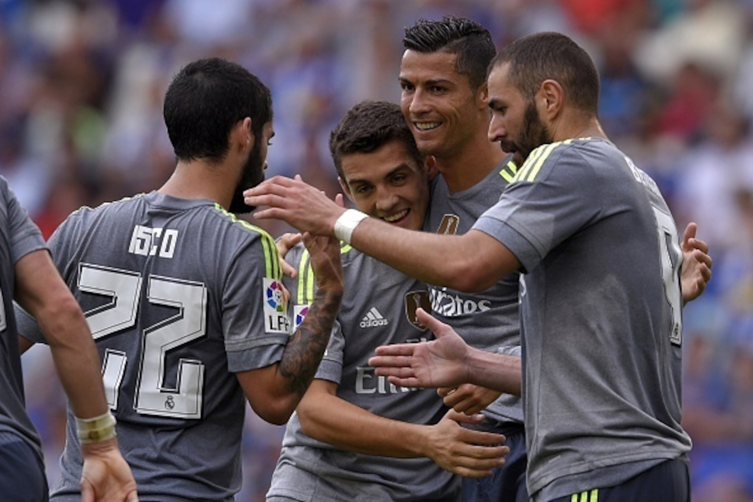 Real Madrid's Portuguese forward Cristiano Ronaldo (2ndR) celebrates with Real Madrid's Brazilian midfielder Casemiro (2ndL)  and Real Madrid's French forward Karim Benzema (R) after scoring during the Spanish league football match RCD Espanyol vs Real Ma