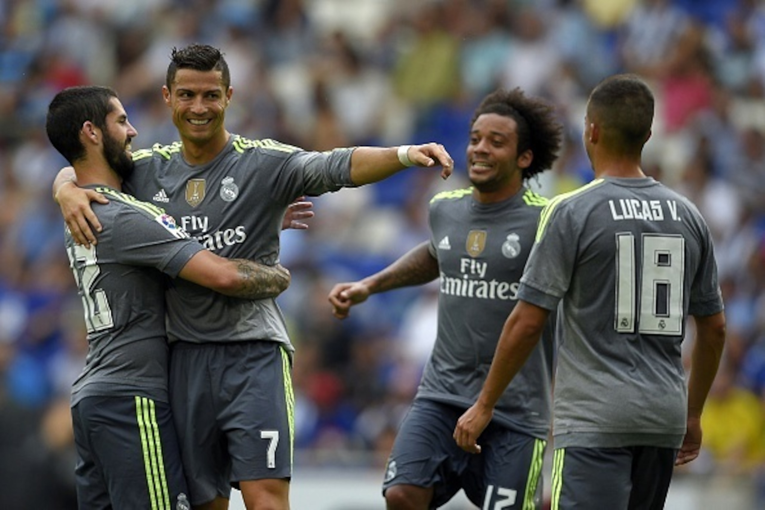 Real Madrid's Portuguese forward Cristiano Ronaldo (2ndL) celebrates with teammates Real Madrid's midfielder Isco (L) and Real Madrid's Brazilian defender Marcelo (2ndR) after scoring during the Spanish league football match RCD Espanyol vs Real Madrid CF