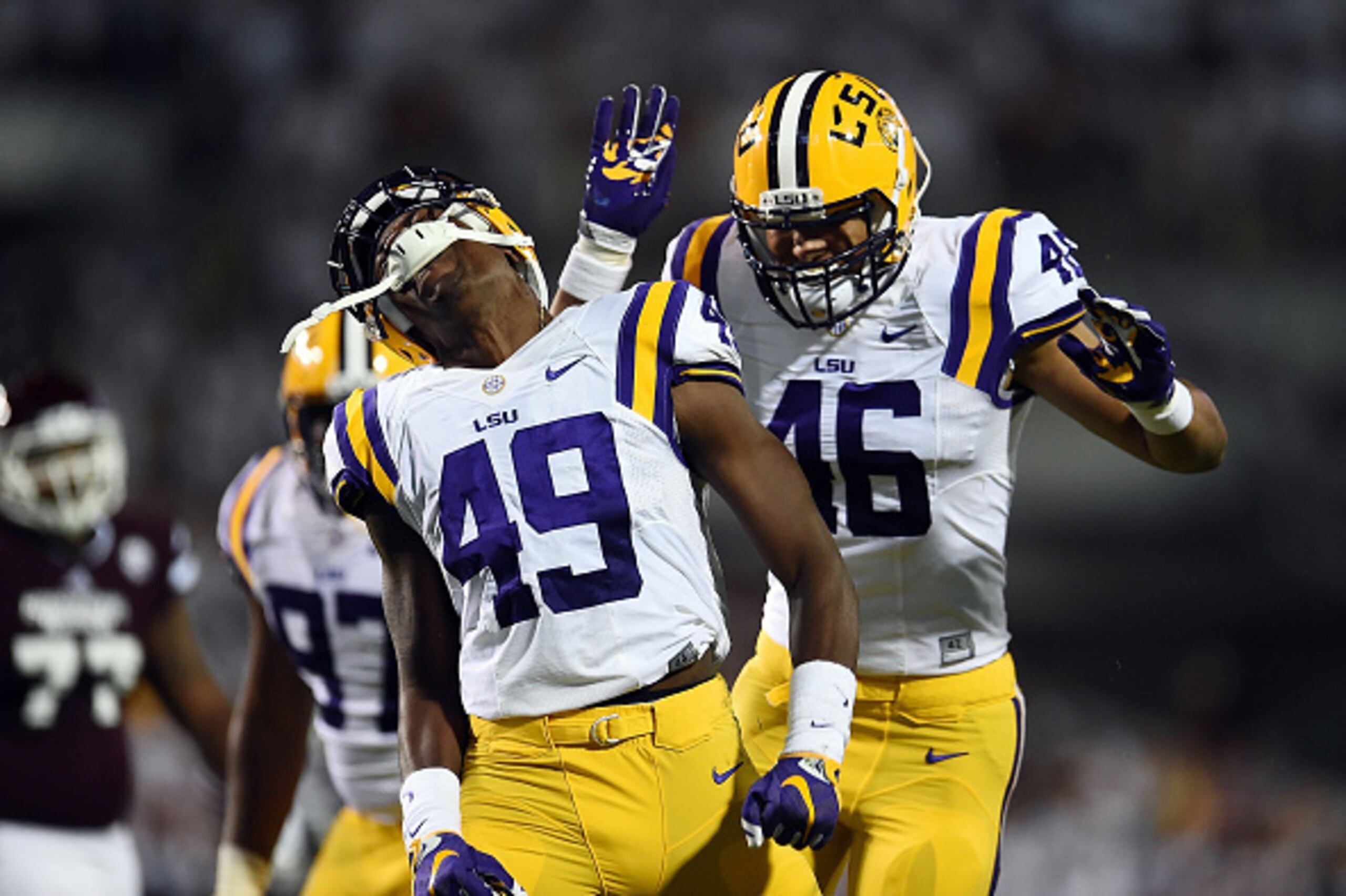 STARKVILLE, MS - SEPTEMBER 12:  Tashawn Bower #46 of the LSU Tigers celebrates with Arden Key #49 following a sack during the second quarter of a game against the Mississippi State Bulldogs at Davis Wade Stadium on September 12, 2015 in Starkville, Missis