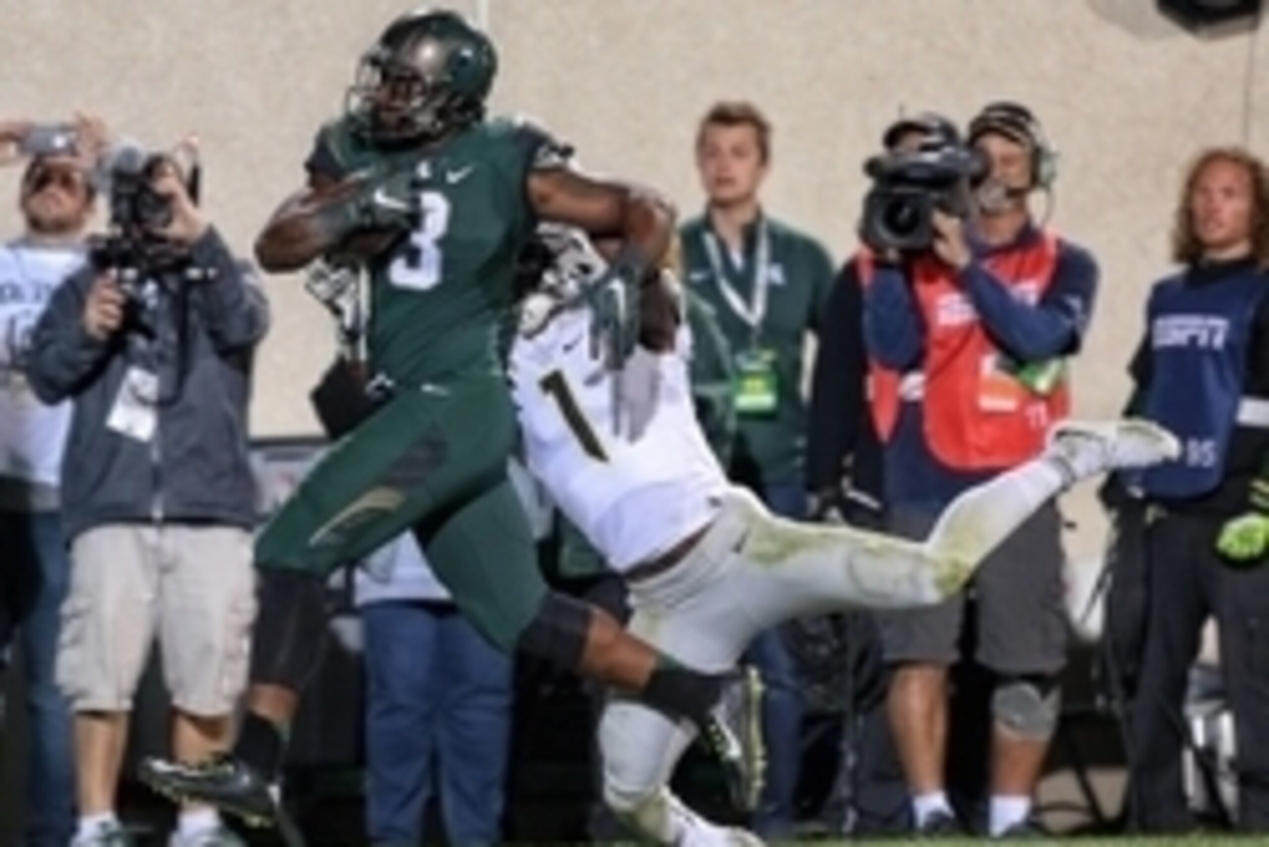 Sep 12, 2015; East Lansing, MI, USA; Michigan State Spartans running back LJ Scott (3) runs the ball for a touchdown against Oregon Ducks defensive back Arrion Springs (1) during the 2nd half of a game at Spartan Stadium. MSU won 31-28. Mandatory Credit: 