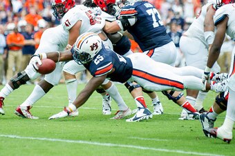 AUBURN, AL - SEPTEMBER 12: Running back Peyton Barber #25 of the Auburn Tigers dives for the end zone during overtime in their game against the Jacksonville State Gamecocks on September 12, 2015 at Jordan-Hare Stadium in Auburn, Alabama. The Auburn Tigers