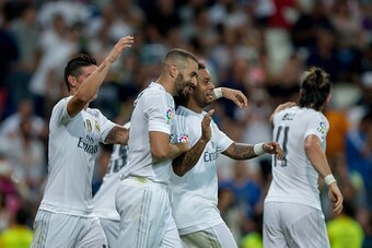 MADRID, SPAIN - AUGUST 29: Karim Benzema (2ndL) celebrates scoring their third goal with teammates James Rodriguez (L), Marcelo (2ndR) and Gareth Bale (L) during the La Liga match between Real Madrid CF and Real Betis Balompie at Estadio Santiago Bernabeu