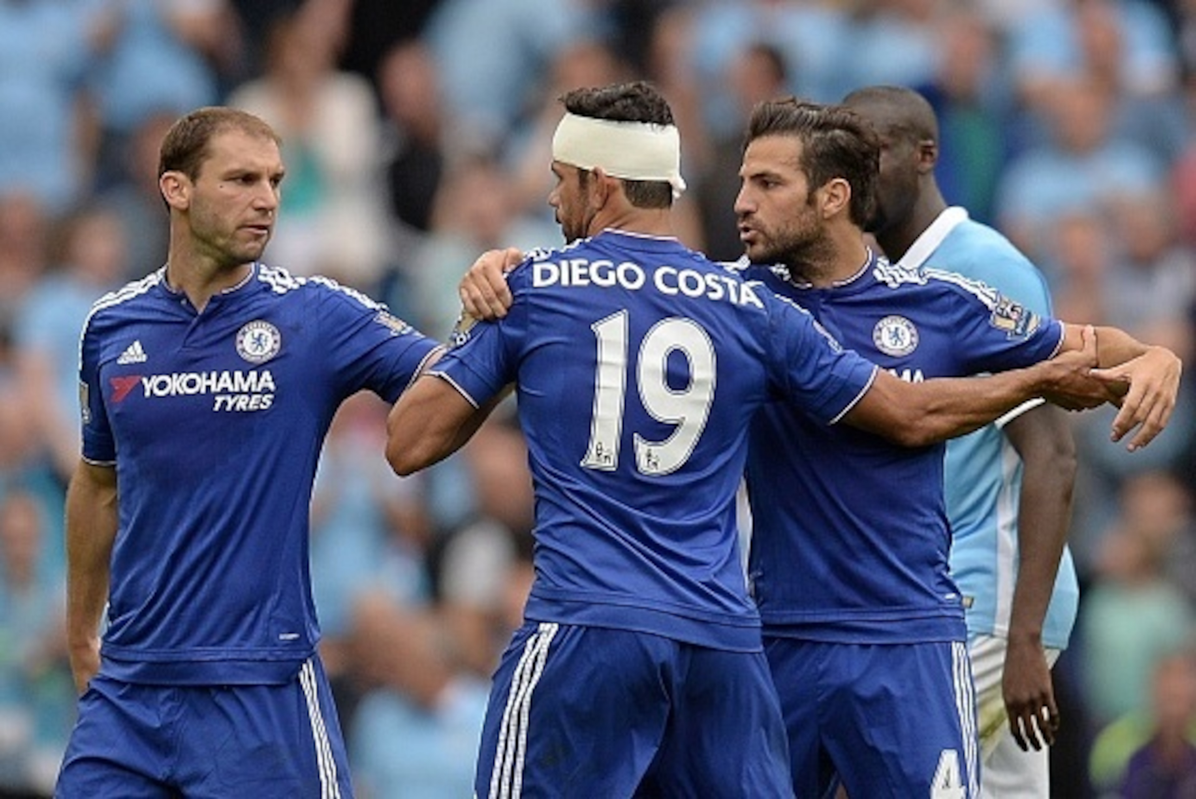 Chelsea's Serbian defender Branislav Ivanovic (L) and Chelsea's Spanish midfielder Cesc Fabregas restrain Chelsea's Brazilian-born Spanish striker Diego Costa (2nd L) as they leave the pitch at half time during the English Premier League football match be