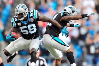 CHARLOTTE, NC - DECEMBER 09: Thomas Davis #58 and Captain Munnerlyn #41 of the Carolina Panthers celebrate after Davis's interception of Matt Ryan #2 of the Atlanta Falcons during play at Bank of America Stadium on December 9, 2012 in Charlotte, North Car