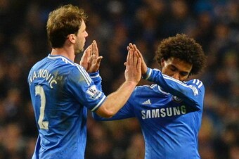Chelsea's Serbian defender Branislav Ivanovic (L) and Chelsea's Brazilian midfielder Willian celebrate after beating Manchester City 1-0 during an English Premier League football match between Manchester City and Chelsea at the Etihad Stadium in Mancheste