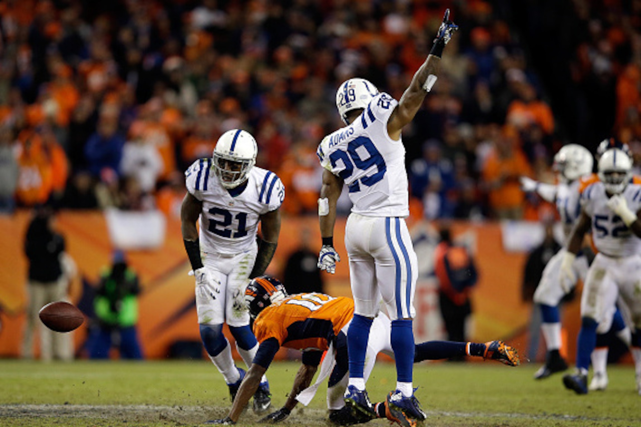 DENVER, CO - JANUARY 11: Vontae Davis #21 and Mike Adams #29 of the Indianapolis Colts and Emmanuel Sanders #10 of the Denver Broncos react after a broken play during a 2015 AFC Divisional Playoff game at Sports Authority Field at Mile High on January DENVER, CO - JANUARY 11: Vontae Davis #21 and Mike Adams #29 of the Indianapolis Colts and Emmanuel Sanders #10 of the Denver Broncos react after a broken play during a 2015 AFC Divisional Playoff game at Sports Authority Field at Mile High on January