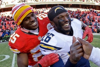 Brandon Flowers is embraced by former teammates Jamaal Charles.