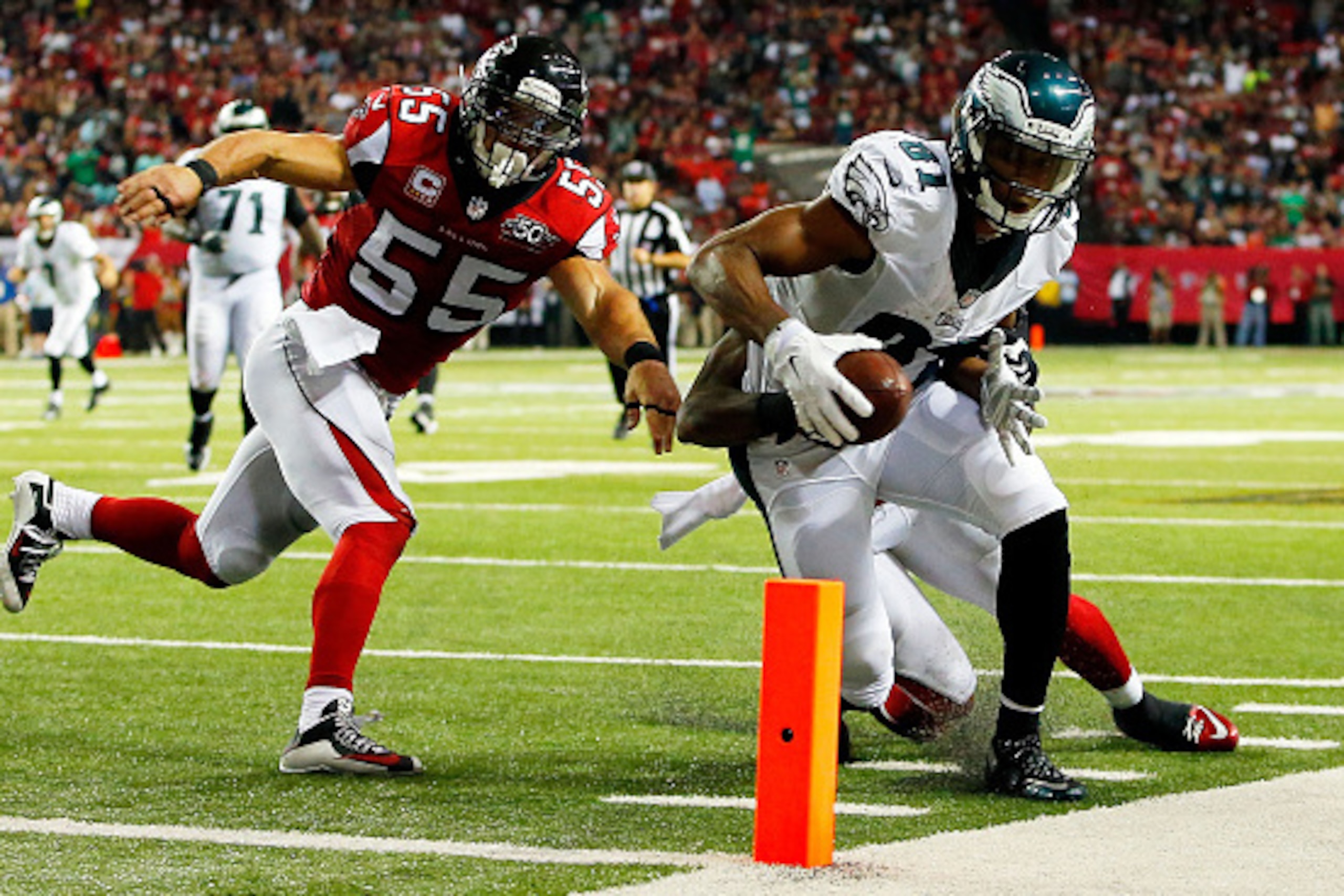 ATLANTA, GA - SEPTEMBER 14: Jordan Matthews #81 of the Philadelphia Eagles fails to score a touchdown after being pushed out of bounds by Paul Worrilow #55 of the Atlanta Falcons during the second half at the Georgia Dome on September 14, 2015 in Atlanta,