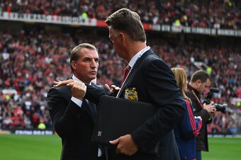 MANCHESTER, ENGLAND - SEPTEMBER 12:  Brendan Rodgers, manager of Liverpool shakes hands with Louis van Gaal, manager of Manchester United during the Barclays Premier League match between Manchester United and Liverpool at Old Trafford on September 12, 201
