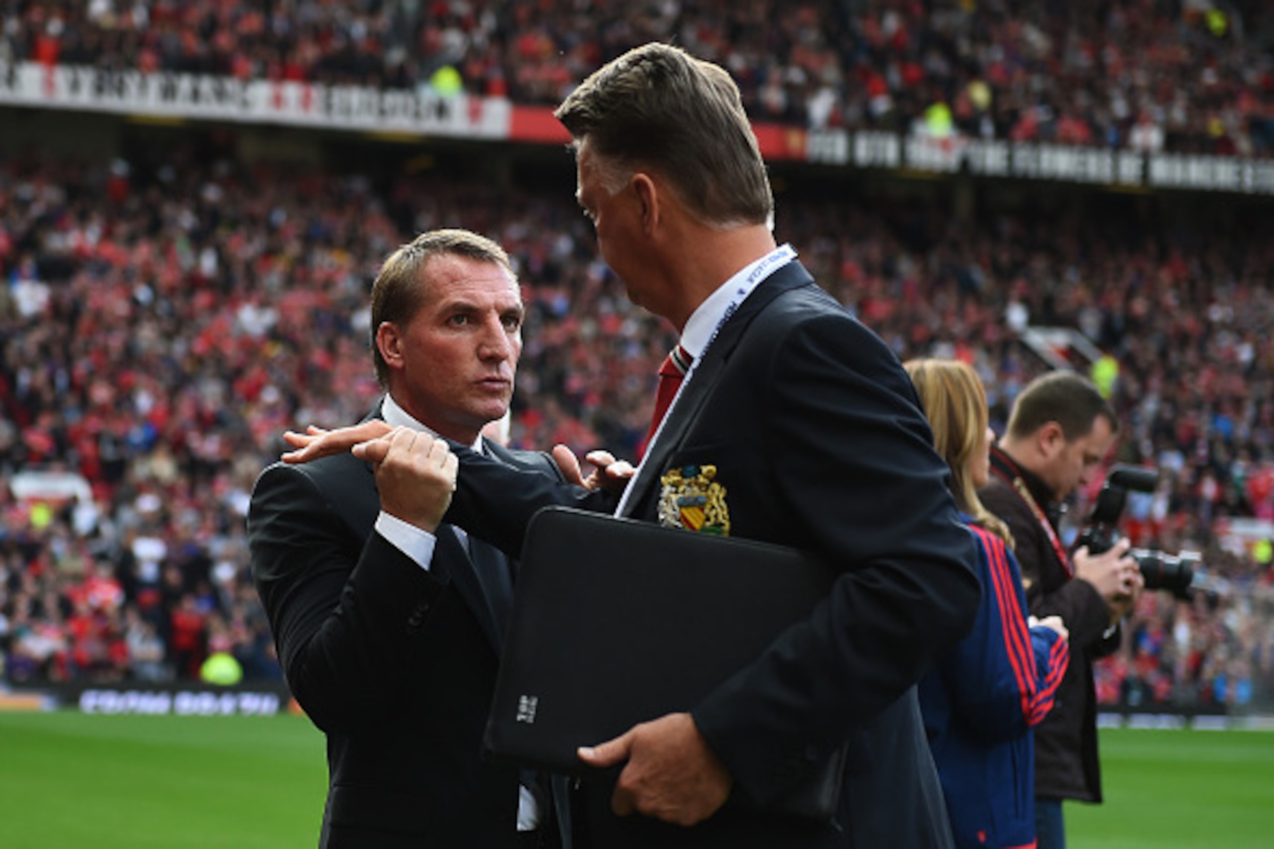 MANCHESTER, ENGLAND - SEPTEMBER 12: Brendan Rodgers, manager of Liverpool shakes hands with Louis van Gaal, manager of Manchester United during the Barclays Premier League match between Manchester United and Liverpool at Old Trafford on September 12, 201 MANCHESTER, ENGLAND - SEPTEMBER 12: Brendan Rodgers, manager of Liverpool shakes hands with Louis van Gaal, manager of Manchester United during the Barclays Premier League match between Manchester United and Liverpool at Old Trafford on September 12, 201