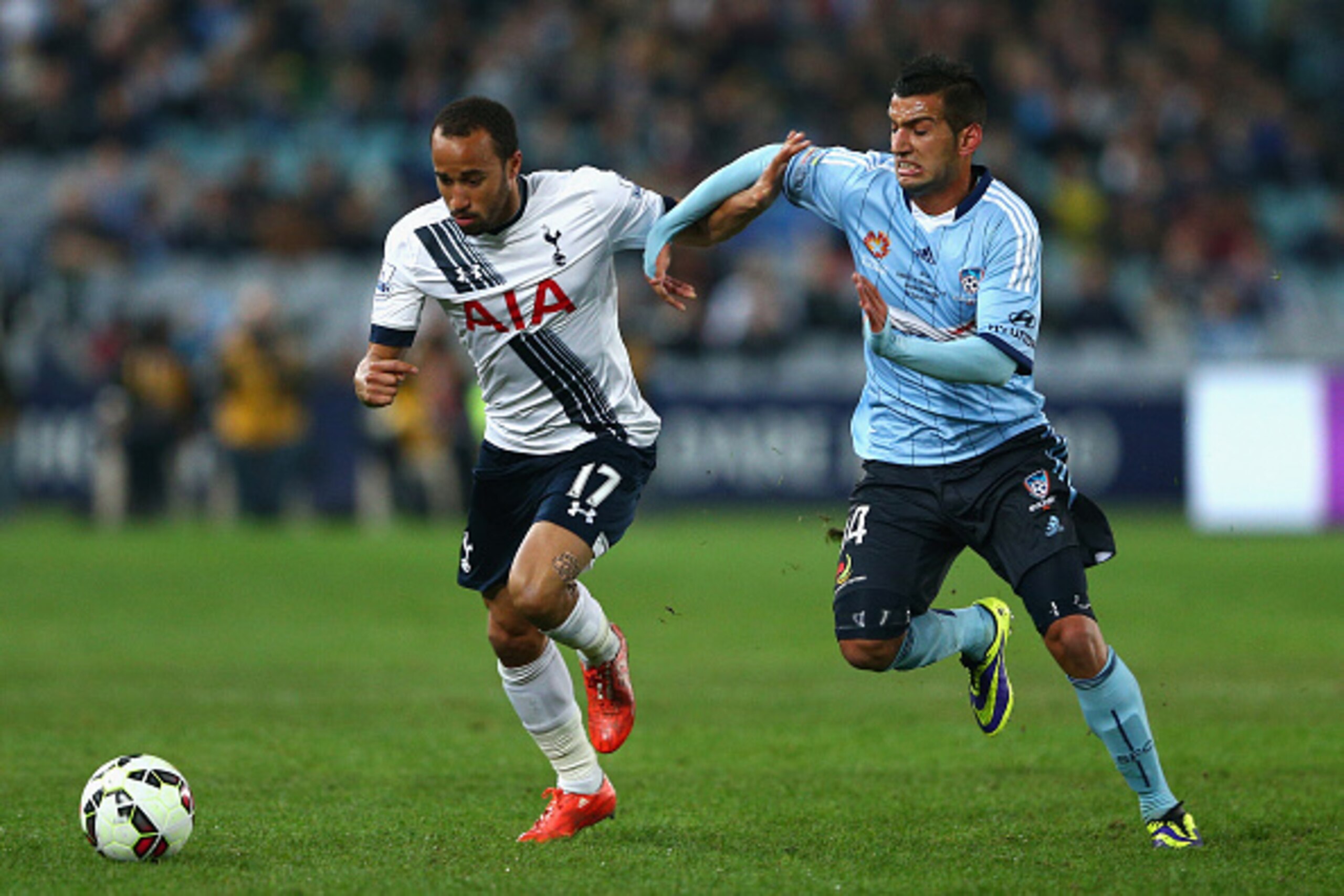 SYDNEY, AUSTRALIA - MAY 30:  Andros Townsend of Hotspur and  Robert Stambolziev of Sydney FC contest the ball during the international friendly match between Sydney FC and Tottenham Spurs at ANZ Stadium on May 30, 2015 in Sydney, Australia.  (Photo by Cam