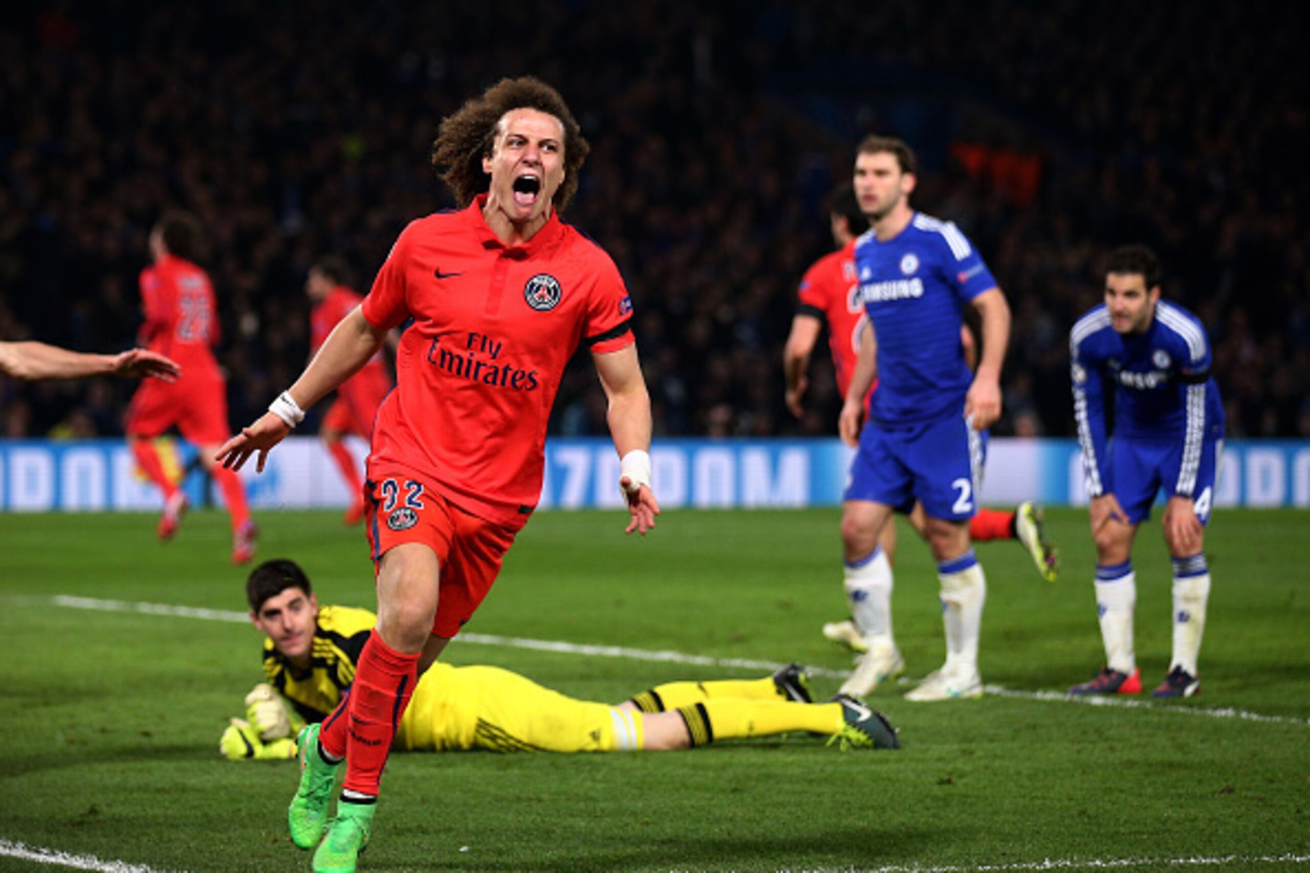 LONDON, ENGLAND - MARCH 11:  David Luiz of PSG celebrates after teammate Thiago Silva of PSG scores a goal to level the scores at 2-2 during the UEFA Champions League Round of 16, second leg match between Chelsea and Paris Saint-Germain at Stamford Bridge
