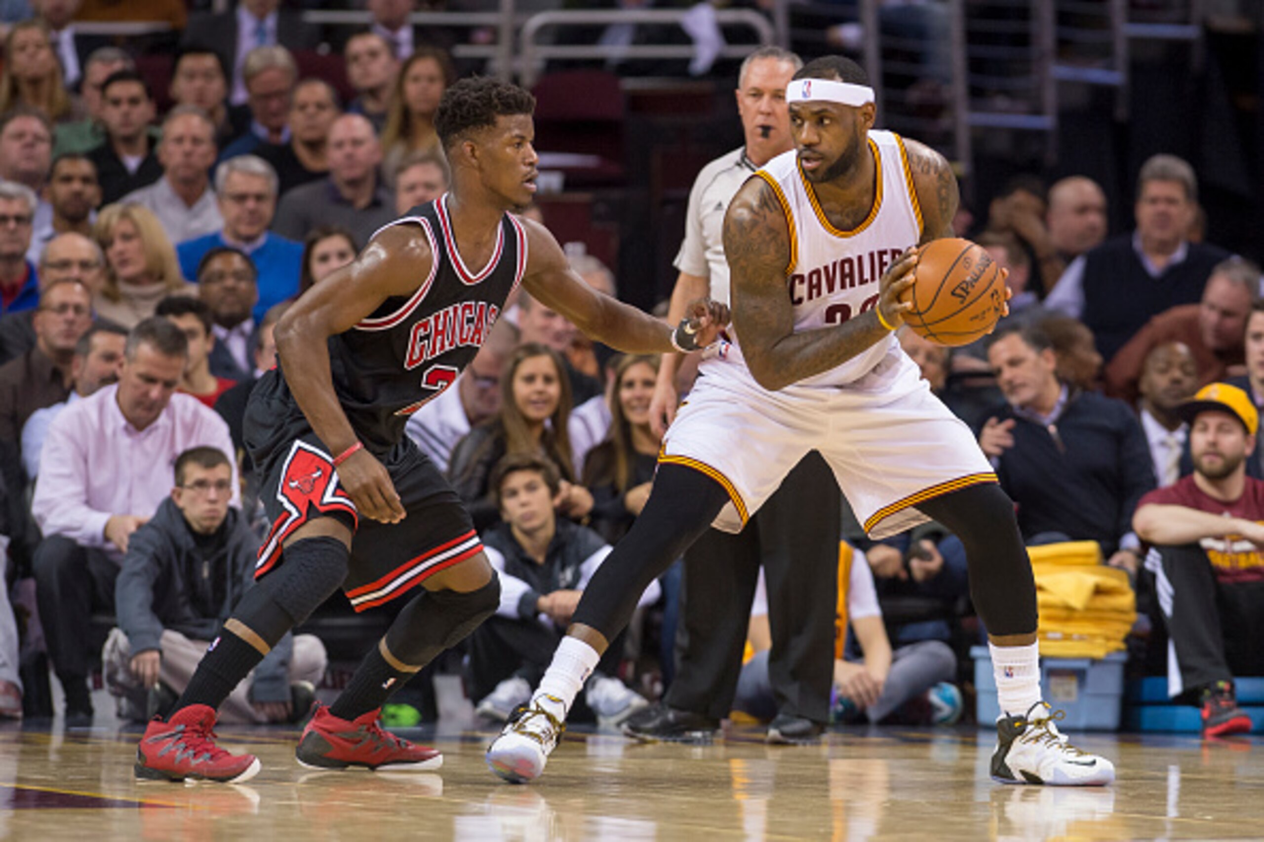 CLEVELAND, OH - JANUARY 19:  Jimmy Butler #21 of the Chicago Bulls guards LeBron James #23 of the Cleveland Cavaliers during the first half at Quicken Loans Arena on January 19, 2015 in Cleveland, Ohio. NOTE TO USER: User expressly acknowledges and agrees
