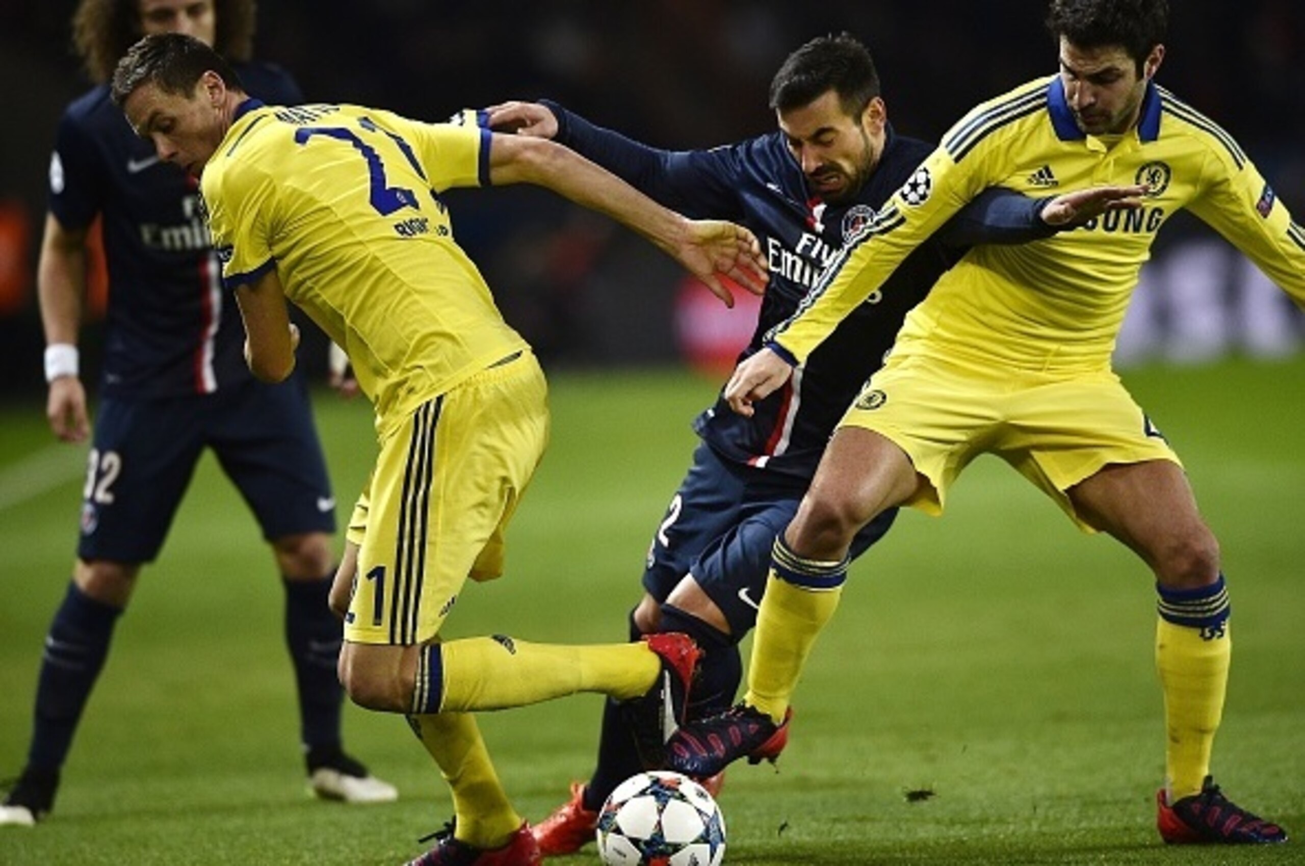 Paris Saint-Germain's Argentinian midfielder Ezequiel Lavezzi (C) challenges Chelsea's Spanish midfielder Cesc Fabregas and Chelsea's Serbian midfielder Nemanja Matic (L) during the UEFA Champions League round of 16 football match between Paris Saint-Germ Paris Saint-Germain's Argentinian midfielder Ezequiel Lavezzi (C) challenges Chelsea's Spanish midfielder Cesc Fabregas and Chelsea's Serbian midfielder Nemanja Matic (L) during the UEFA Champions League round of 16 football match between Paris Saint-Germ