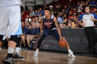 LAS VEGAS, NV - JULY 17:  Kelly Oubre Jr. #12 of the Washington Wizards dribbles the ball against the Denver Nuggets on July 17, 2015 at Cox Pavilion in Las Vegas, Nevada. NOTE TO USER: User expressly acknowledges and agrees that, by downloading and or us