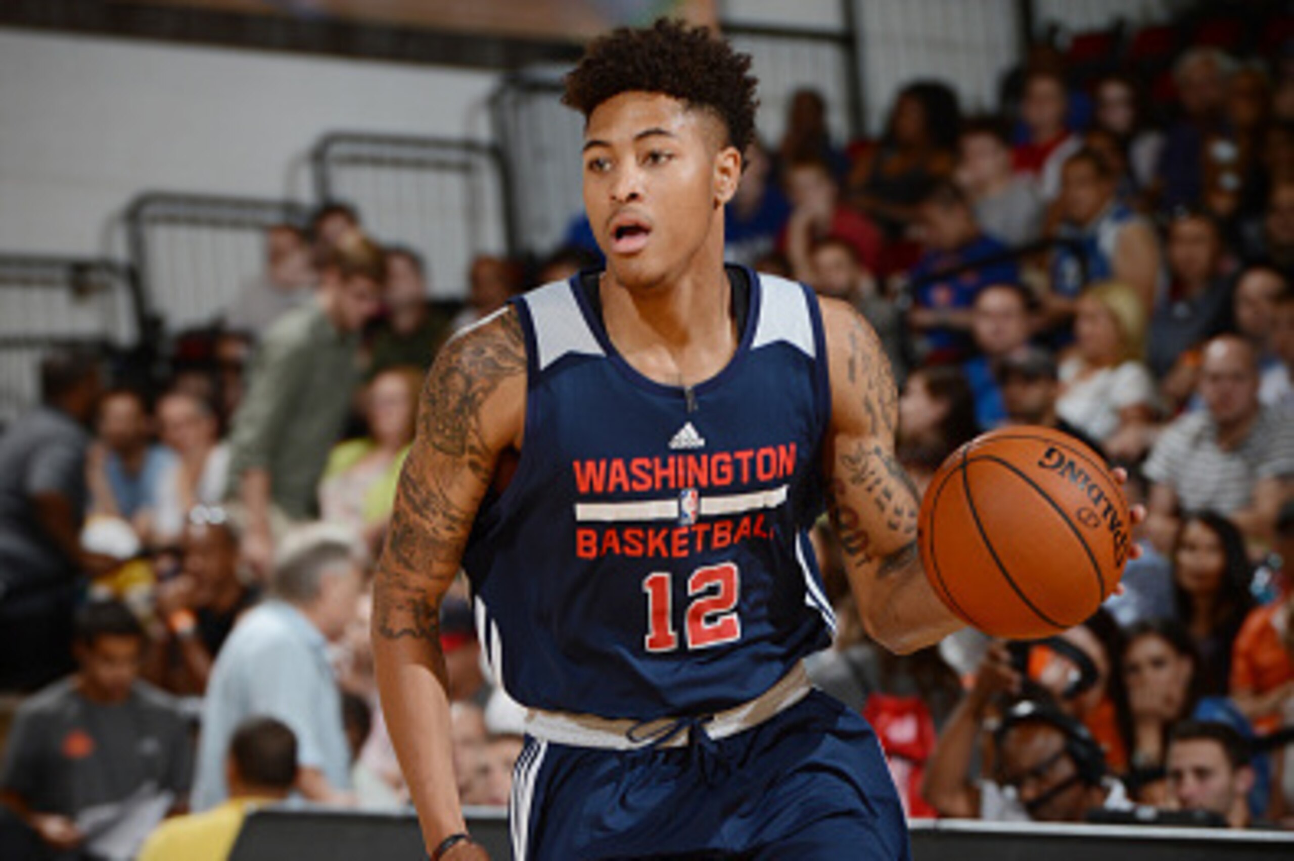 LAS VEGAS, NV - JULY 11: Kelly Oubre Jr. #12 of the Washington Wizards drives to the basket against the Phoenix Suns during the game on July 11, 2015 at Thomas & Mack Center, Las Vegas, Nevada. NOTE TO USER: User expressly acknowledges and agrees that, b LAS VEGAS, NV - JULY 11: Kelly Oubre Jr. #12 of the Washington Wizards drives to the basket against the Phoenix Suns during the game on July 11, 2015 at Thomas & Mack Center, Las Vegas, Nevada. NOTE TO USER: User expressly acknowledges and agrees that, b