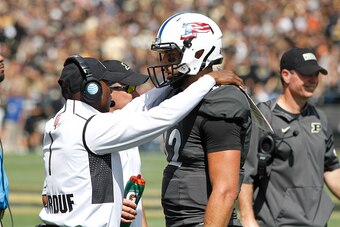 WEST LAFAYETTE, IN - SEPTEMBER 12:  Purdue Boilermakers Head Coach Darrell Hazell talks with Austin Appleby #12 during a time out in the second half against the Indiana State Sycamores at Ross-Ade Stadium on September 12, 2015 in West Lafayette, Indiana. 