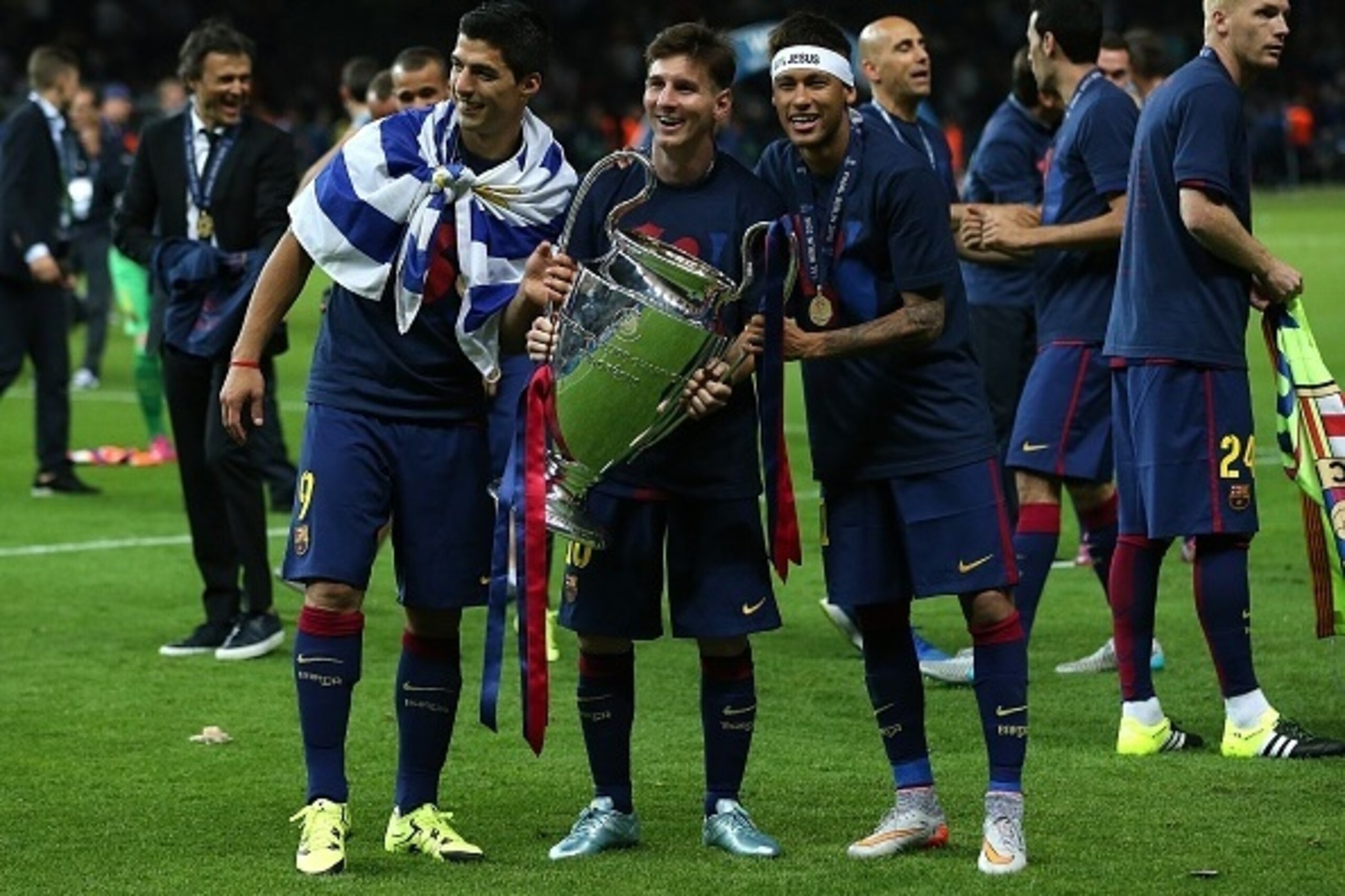 BERLIN, GERMANY - JUNE 6: (l-r) Luis Suarez, Lionel Messi and Neymar of FC Barcelona celebrate with the trophy following the UEFA Champions League Final match between Juventus and FC Barcelona at the Olympiastadion on June 6, 2015 in Berlin, Germany. (Pho