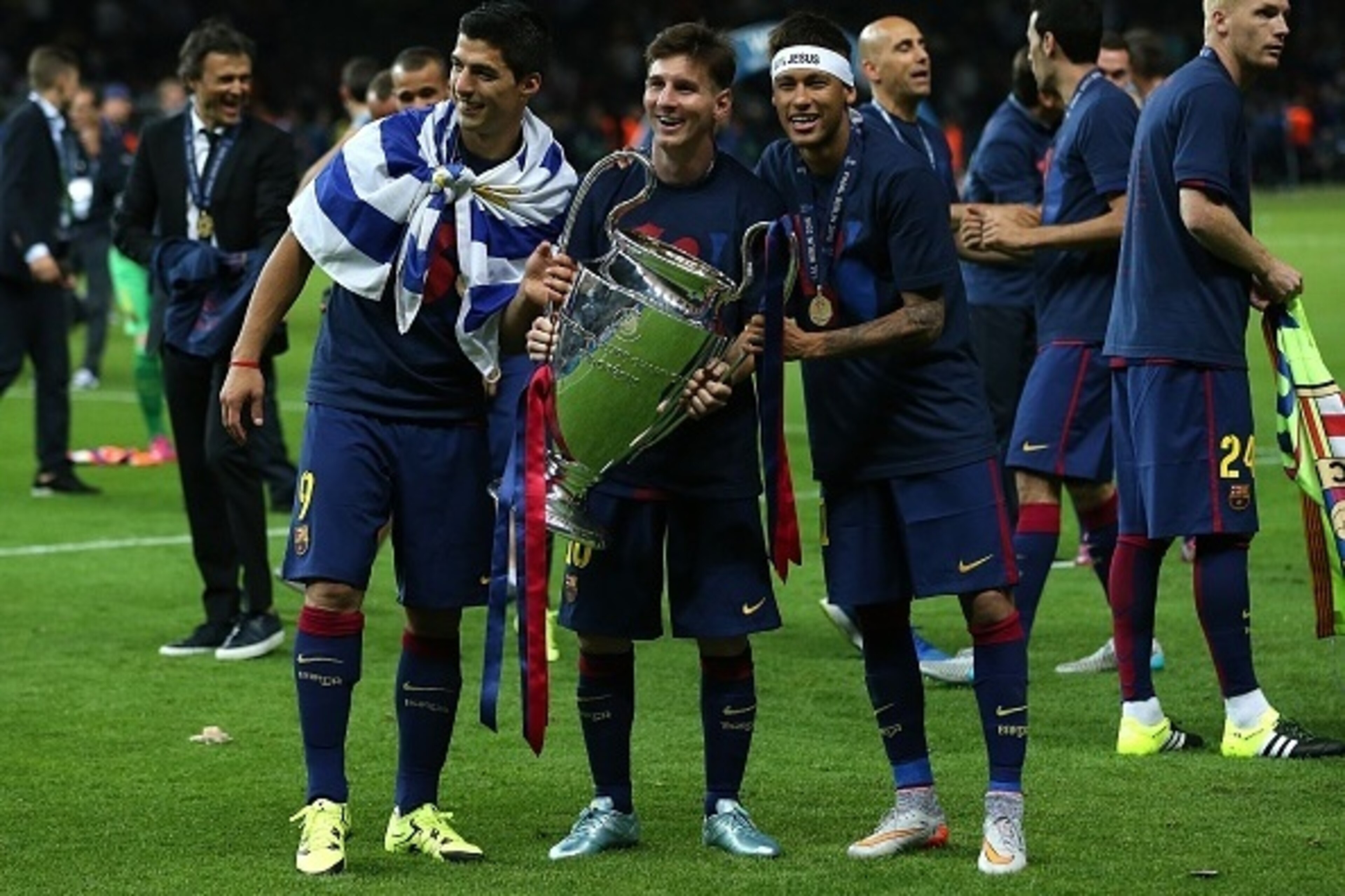 BERLIN, GERMANY - JUNE 6: (l-r) Luis Suarez, Lionel Messi and Neymar of FC Barcelona celebrate with the trophy following the UEFA Champions League Final match between Juventus and FC Barcelona at the Olympiastadion on June 6, 2015 in Berlin, Germany. (Pho BERLIN, GERMANY - JUNE 6: (l-r) Luis Suarez, Lionel Messi and Neymar of FC Barcelona celebrate with the trophy following the UEFA Champions League Final match between Juventus and FC Barcelona at the Olympiastadion on June 6, 2015 in Berlin, Germany. (Pho