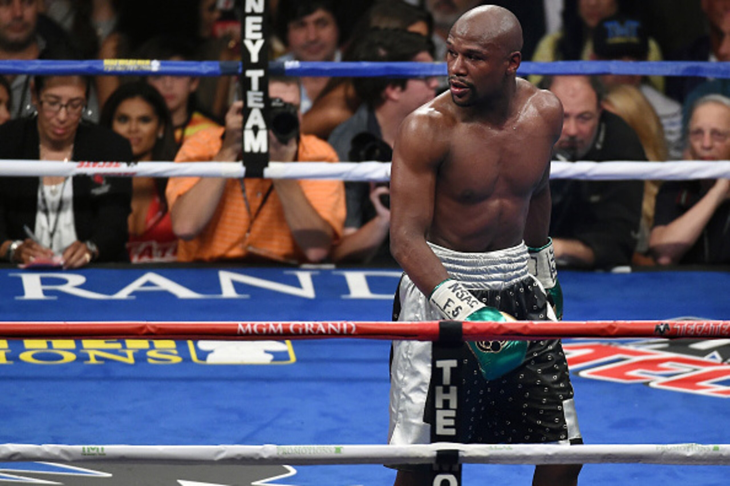 LAS VEGAS, NV - SEPTEMBER 12:  Floyd Mayweather Jr. looks back at Andre Berto's corner after the sixth round of their WBC/WBA welterweight title fight at MGM Grand Garden Arena on September 12, 2015 in Las Vegas, Nevada. Mayweather retained his titles wit