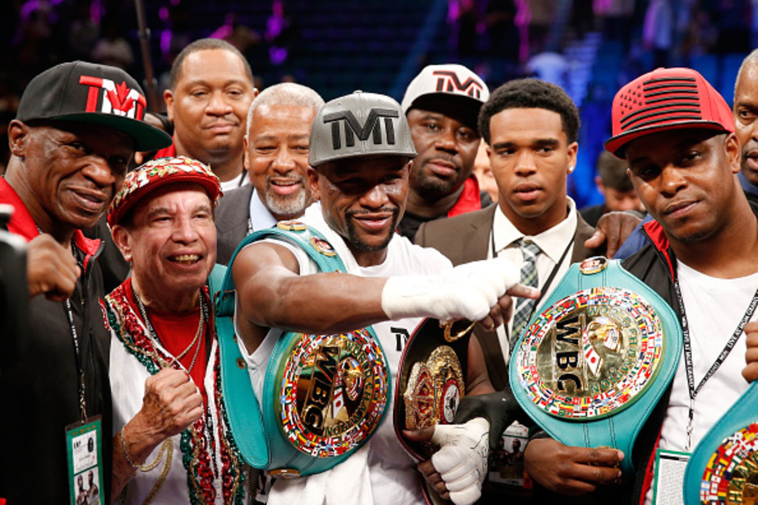 LAS VEGAS, NV - SEPTEMBER 12:  (L-R) Floyd Mayweather Sr., Rafael Garcia, Floyd Mayweather Jr. and DeJuan Blake pose in the ring following their WBC/WBA welterweight title fight against Andre Berto at MGM Grand Garden Arena on September 12, 2015 in Las Ve