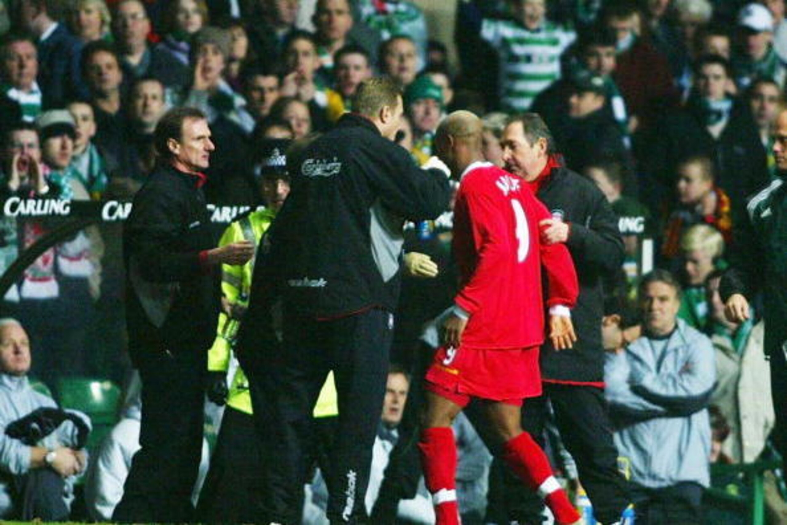 GLASGOW - MARCH 13:  El Hadji Diouf of Liverpool leaves the field after his incident in the crowd during the Glasgow Celtic v Liverpool UEFA Cup Quarter Final match at Celtic Park in Glasgow, Scotland on March 13, 2003. (Photo by Ben Radford/Getty Images)