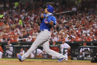 ST. LOUIS, MO - SEPTEMBER 8: Starlin Castro #13 of the Chicago Cubs hits a three-run homerun in the second inning against the St. Louis Cardinals at Busch Stadium on September 8, 2015 in St. Louis, Missouri.  (Photo by Michael Thomas/Getty Images)