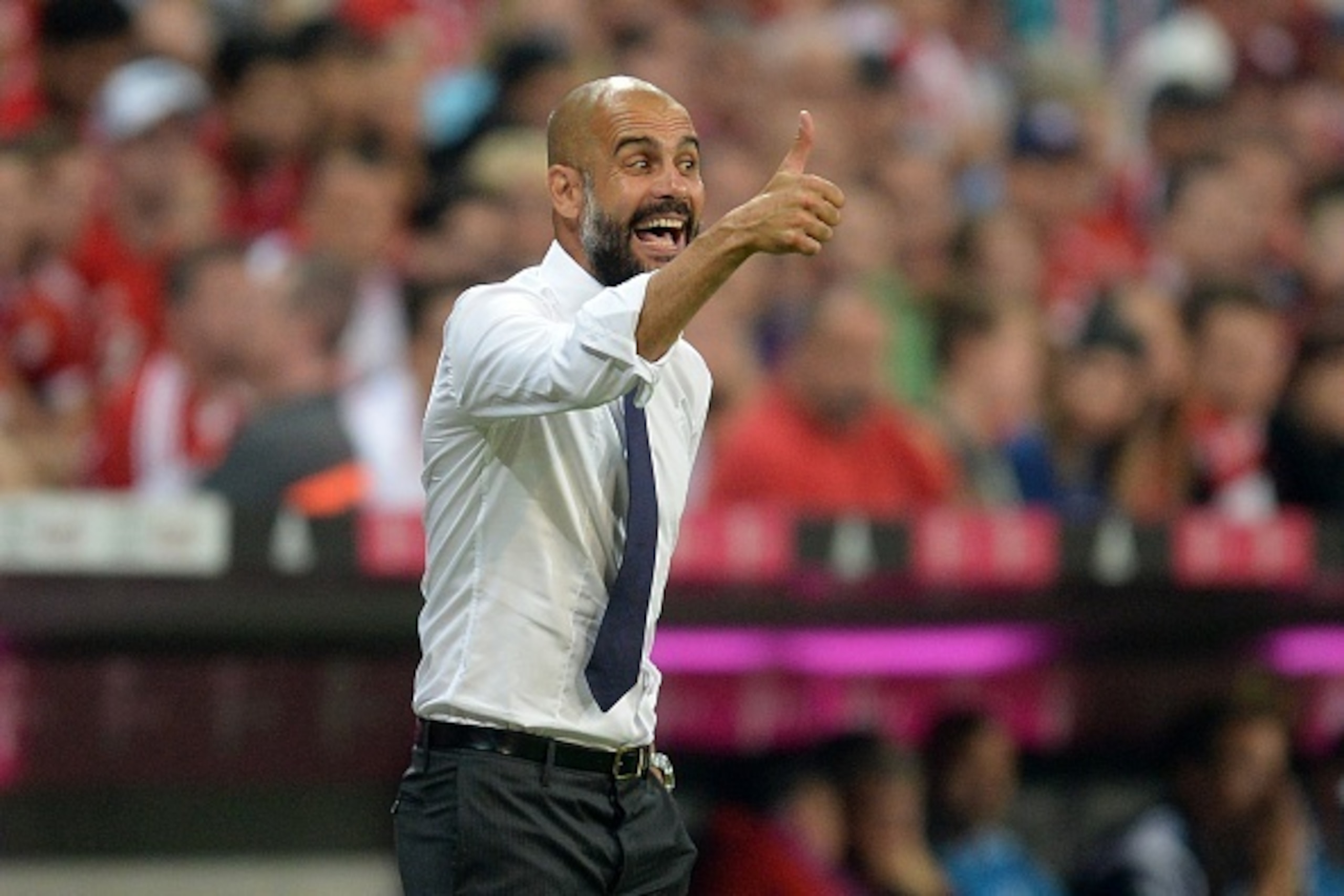 Bayern Munich's Spanish headcoach Pep Guardiola reacts during the German first division Bundesliga football match FC Bayern Munich vs Hamburger SV at the Allianz Arena in Munich, southern Germany, on August 14, 2015. The match is the first of the 2015/201