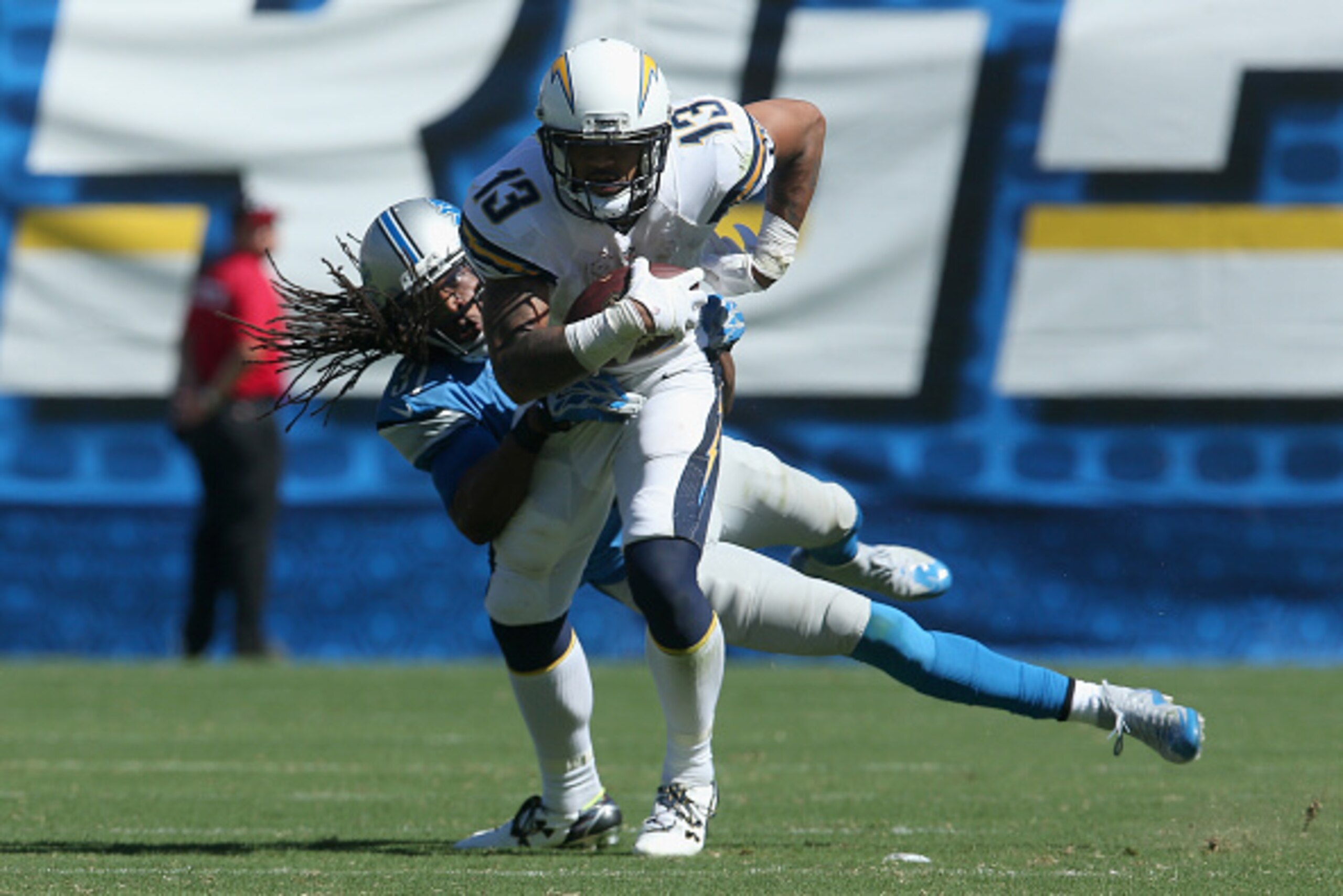 SAN DIEGO, CA - SEPTEMBER 13:  Wide receiver Keenan Allen #13 of the San Diego Chargers is tackled by cornerback Rashean Mathis #31 of the Detroit Lions at Qualcomm Stadium on September 13, 2015 in San Diego, California.  (Photo by Stephen Dunn/Getty Imag