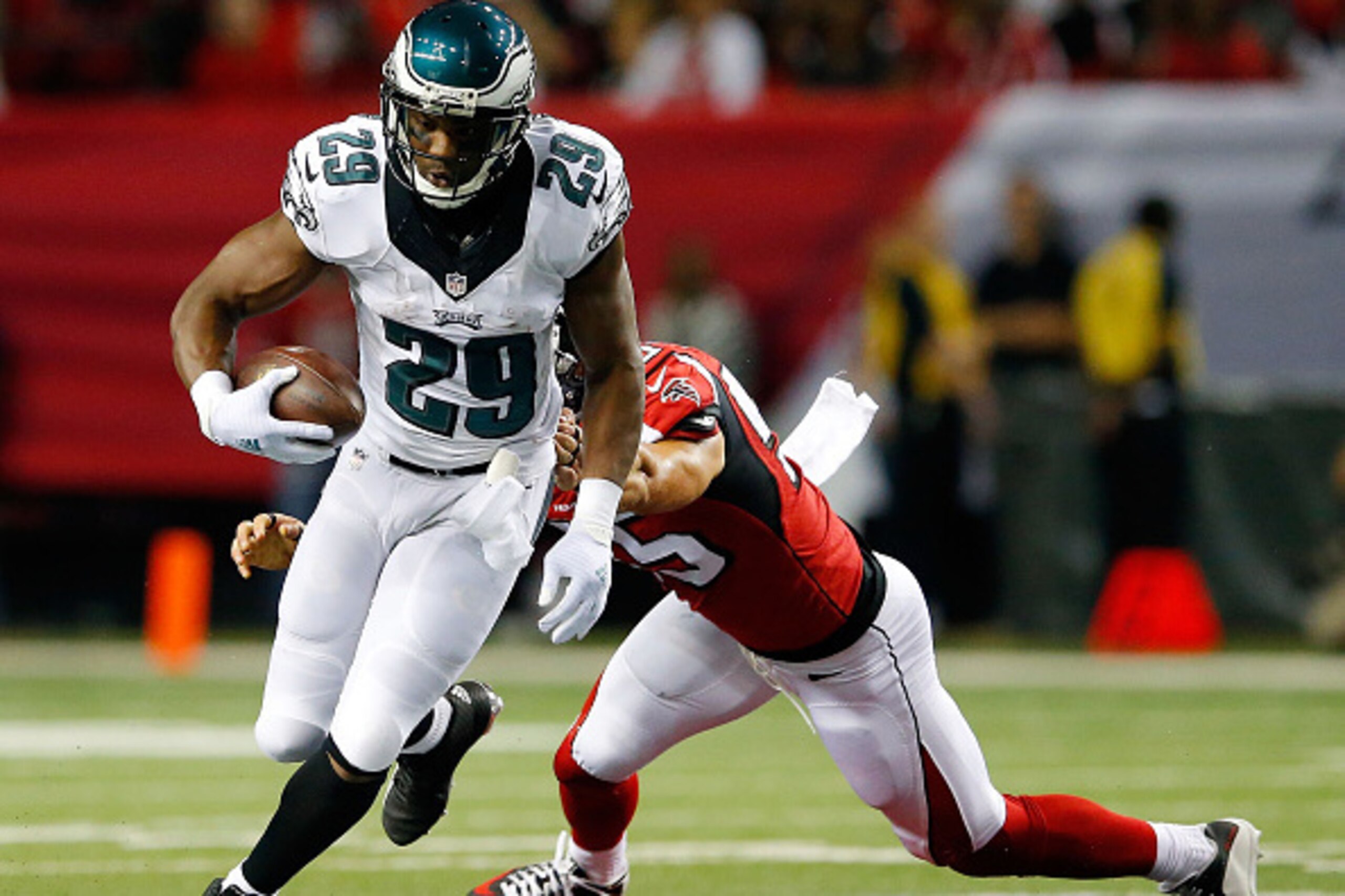 ATLANTA, GA - SEPTEMBER 14:  DeMarco Murray #29 of the Philadelphia Eagles breaks a tackle by Paul Worrilow #55 of the Atlanta Falcons during the first half  at the Georgia Dome on September 14, 2015 in Atlanta, Georgia.  (Photo by Kevin C. Cox/Getty Imag