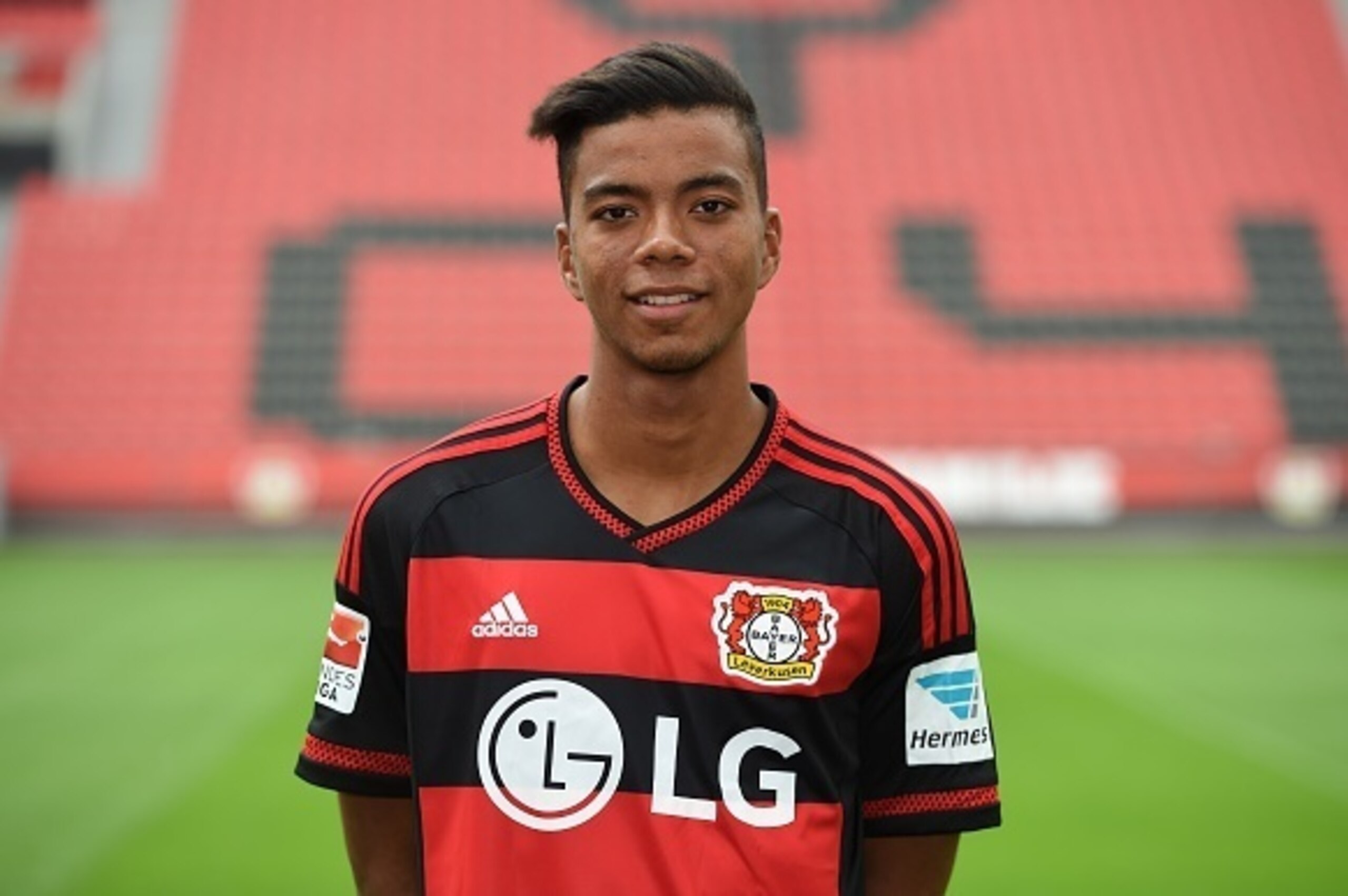 Leverkusen's  midfielder Benjamin Henrichs poses during the team presentation of the German first division Bundesliga team Bayer 04 Leverkusen at the stadium in Leverkusen, western Germany, on July 13, 2015. AFP PHOTO / PATRIK STOLLARZ        (Photo credi