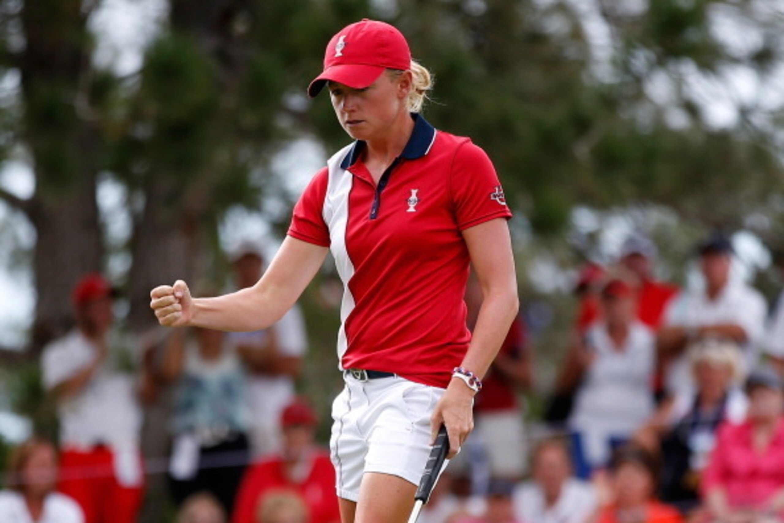 PARKER, CO - AUGUST 18:  Stacy Lewis of the United States Team reacts after making a putt to halve her match against Anna Nordzvist of Sweden and the European Team during the final day singles matches of the 2013 Solheim Cup on August 18, 2013 at The Colo