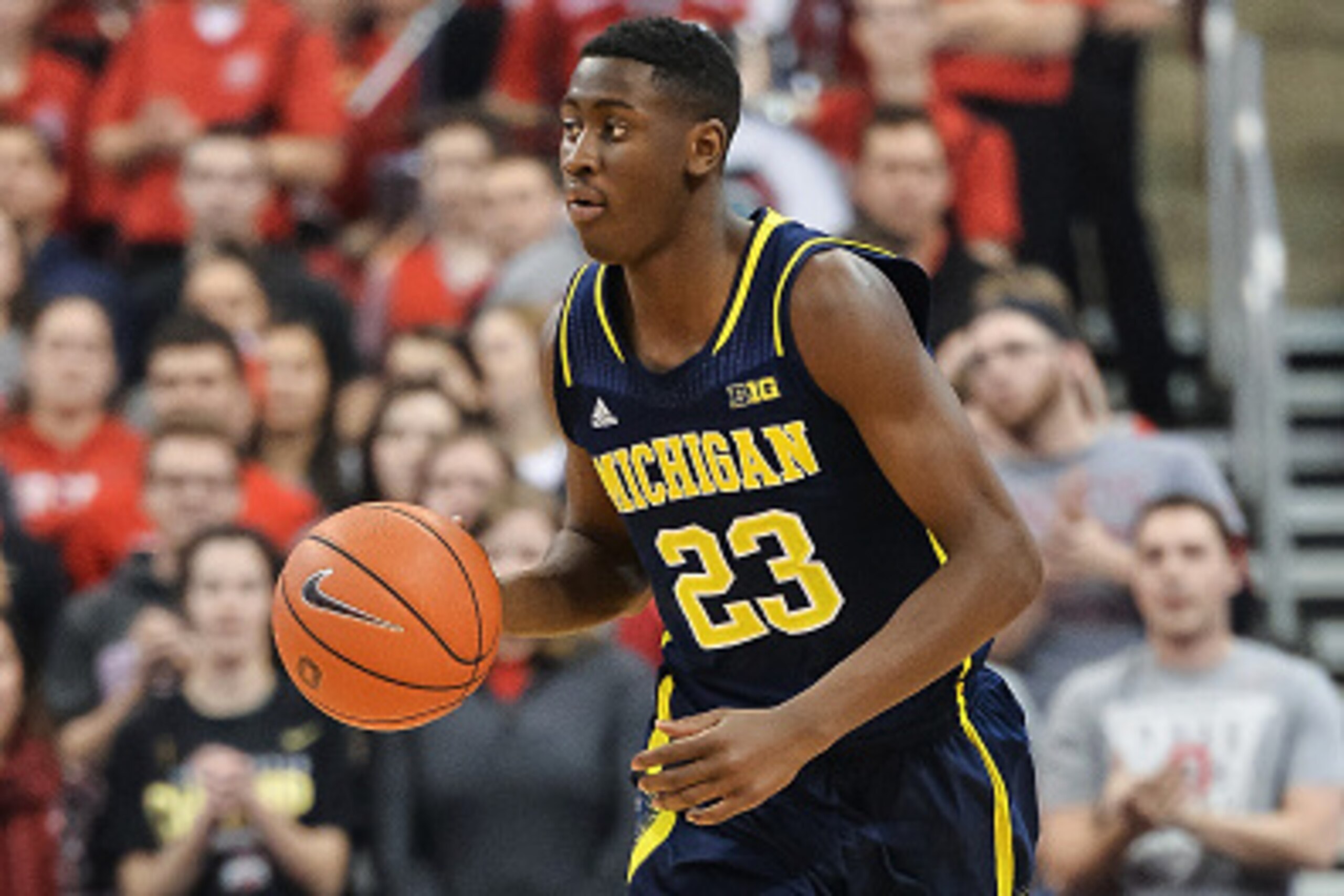 COLUMBUS, OH - JANUARY 13:  Caris LeVert #23 of the Michigan Wolverines controls the ball against the Ohio State Buckeyes on January 13, 2015 at Value City Arena in Columbus, Ohio. Ohio State defeated Michigan 71-52.  (Photo by Jamie Sabau/Getty Images)