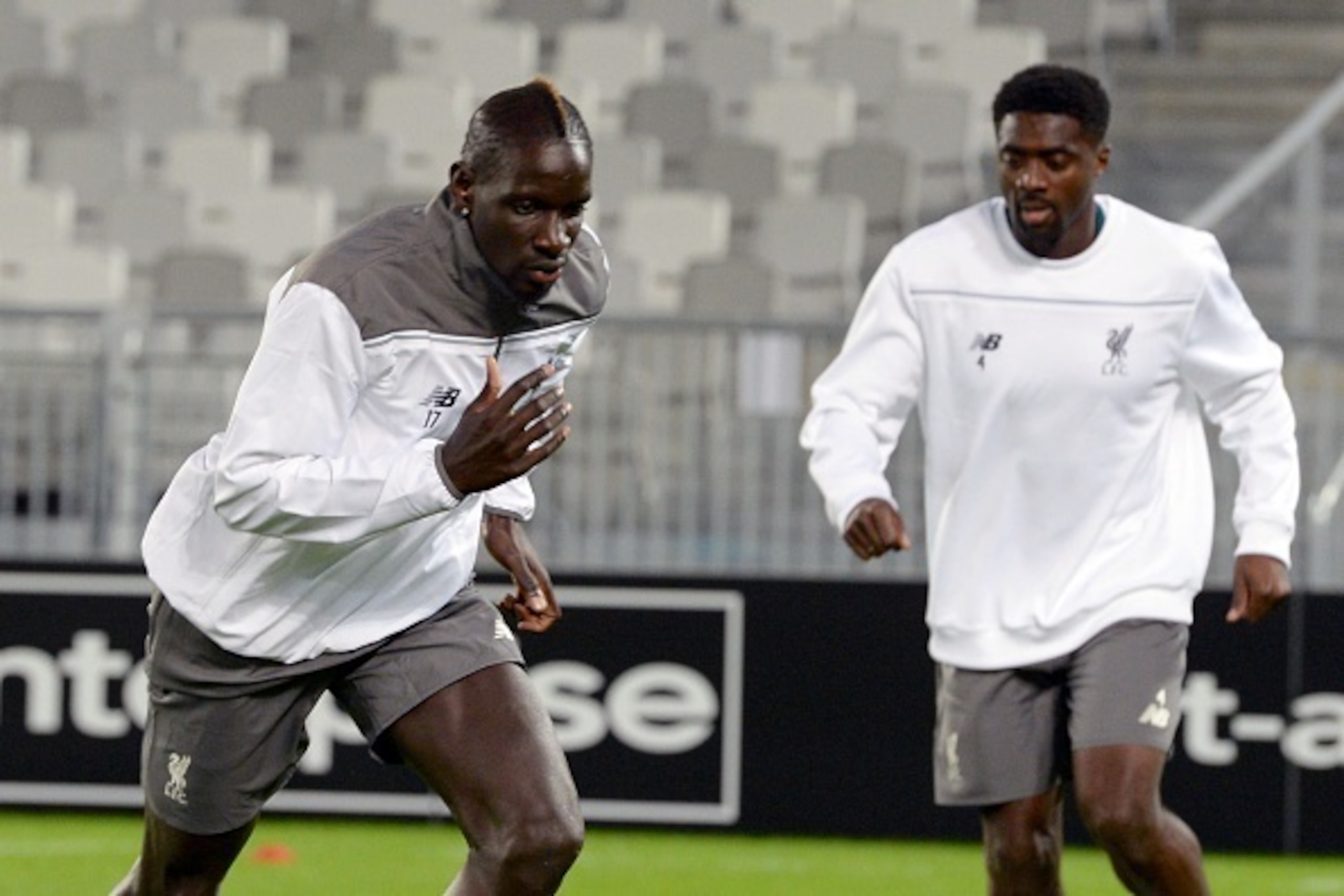 Liverpool's defenders Mamadou Sakho (L) and Kolo Toure (R) warm up during a training session on September 16, 2015 at the Matmut Atlantique stadium in Bordeaux on the eve of the UEFA Europa League Group B Bordeaux vs Liverpool football match. AFP PHOTO / 