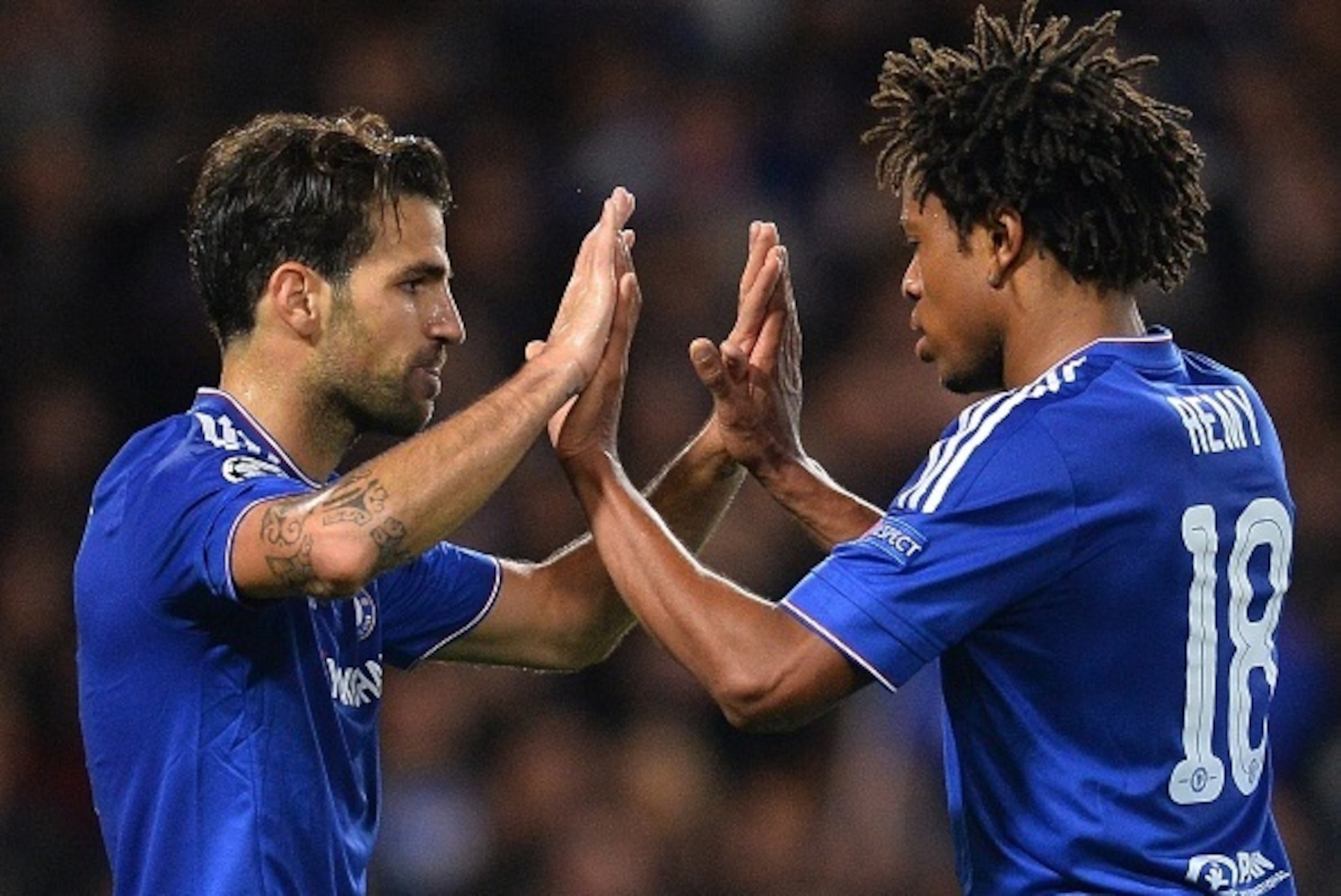 Chelsea's Spanish midfielder Cesc Fabregas (L) celebrates with Chelsea's French striker Loic Remy after scoring his team's fourth goal during the UEFA Champions League, group G, football match between Chelsea and Maccabi Tel Aviv at Stamford Bridge in Lon Chelsea's Spanish midfielder Cesc Fabregas (L) celebrates with Chelsea's French striker Loic Remy after scoring his team's fourth goal during the UEFA Champions League, group G, football match between Chelsea and Maccabi Tel Aviv at Stamford Bridge in Lon