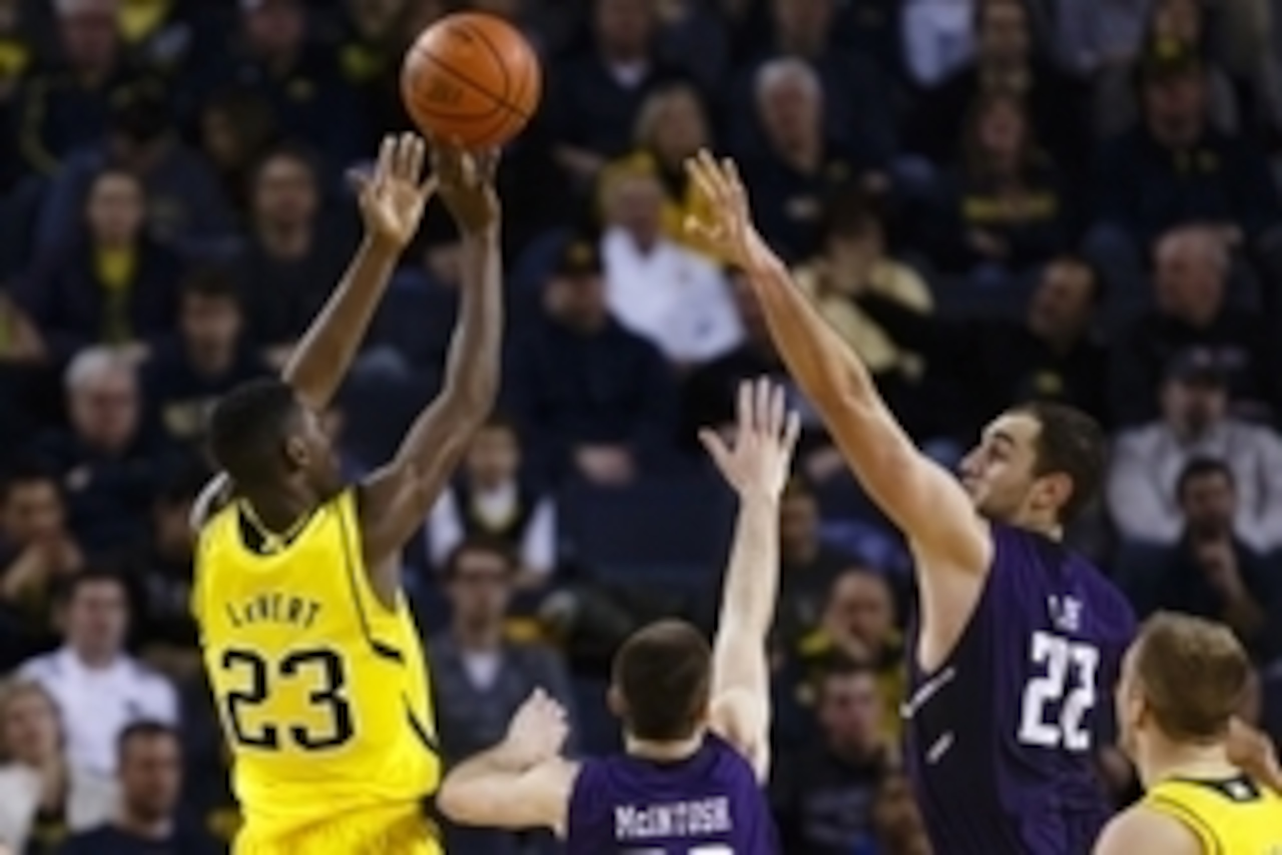 Jan 17, 2015; Ann Arbor, MI, USA; Michigan Wolverines guard Caris LeVert (23) shoots over Northwestern Wildcats center Alex Olah (22) in the second half at Crisler Center. Michigan won 56-54. Mandatory Credit: Rick Osentoski-USA TODAY Sports