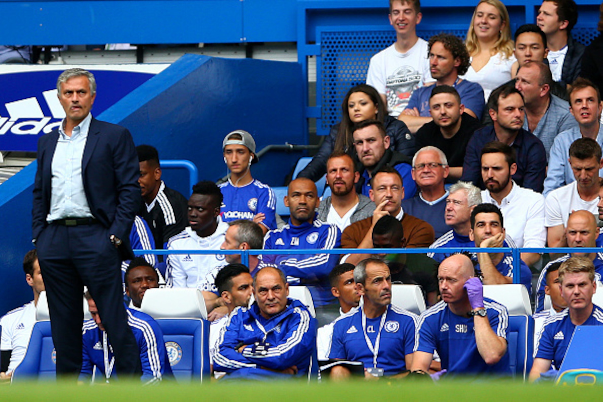 LONDON, ENGLAND - AUGUST 29: Head coach Jose Mourinho of Chelsea stands in front of the bench while John Terry of Chelsea watches from the stand during the Barclays Premier League match between Chelsea and Crystal Palace at Stamford Bridge on August 29, 2 LONDON, ENGLAND - AUGUST 29: Head coach Jose Mourinho of Chelsea stands in front of the bench while John Terry of Chelsea watches from the stand during the Barclays Premier League match between Chelsea and Crystal Palace at Stamford Bridge on August 29, 2