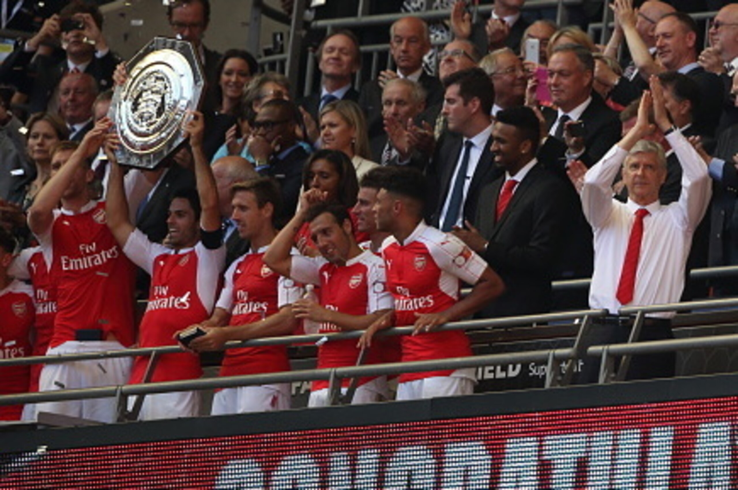 LONDON, ENGLAND - AUGUST 2: Manager Arsene Wenger of Arsenal applauds the fans as his team lift the FA Community Shield trophy after the FA Community Shield match between Chelsea and Arsenal at Wembley Stadium on August 2, 2015 in London, England. (Pho LONDON, ENGLAND - AUGUST 2: Manager Arsene Wenger of Arsenal applauds the fans as his team lift the FA Community Shield trophy after the FA Community Shield match between Chelsea and Arsenal at Wembley Stadium on August 2, 2015 in London, England. (Pho