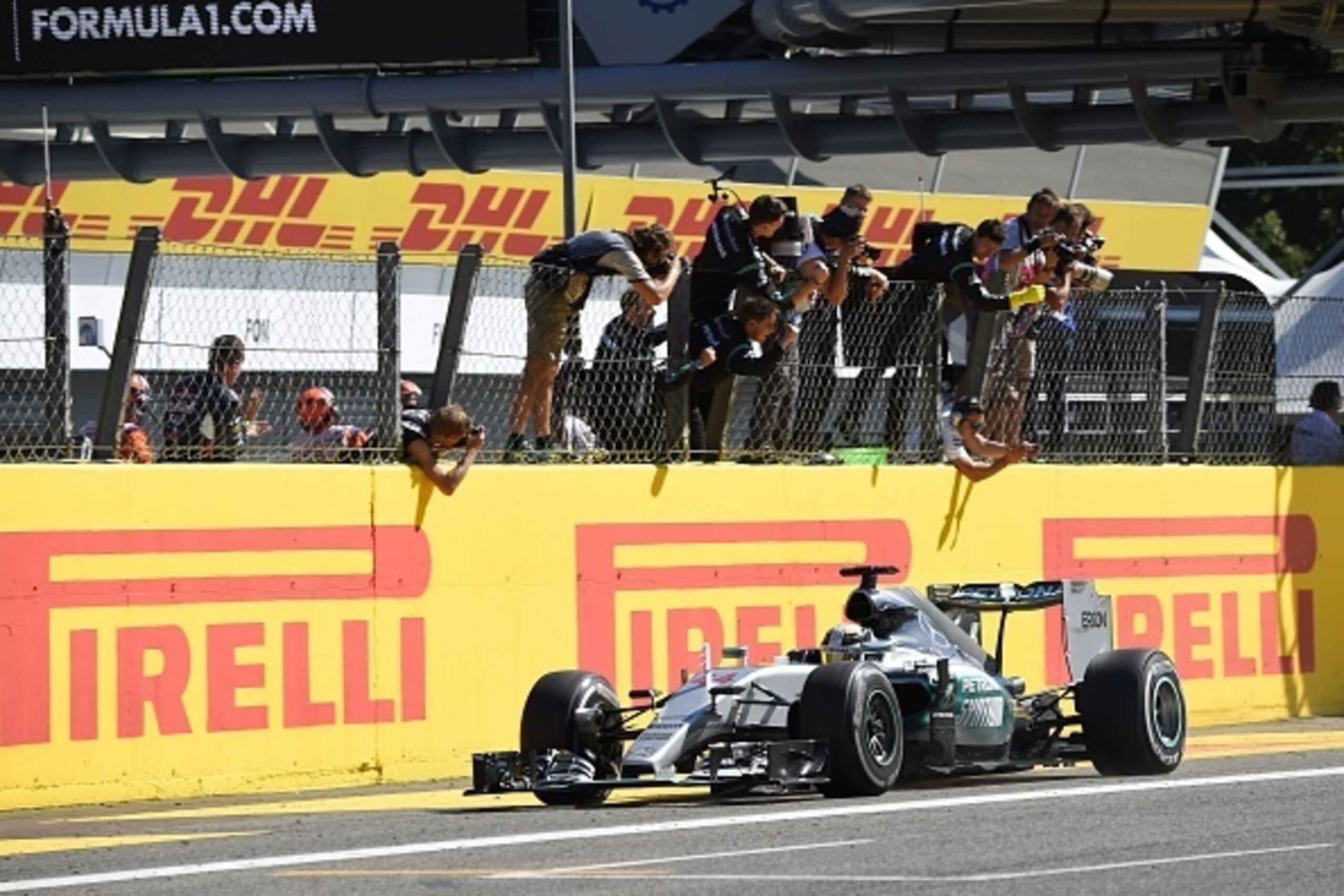 Mercedes AMG Petronas F1 Team's British driver Lewis Hamilton celebrates winning the Italian Formula One Grand Prix at the Autodromo Nazionale circuit in Monza on September 6, 2015.  AFP PHOTO / OLIVIER MORIN        (Photo credit should read OLIVIER MORIN