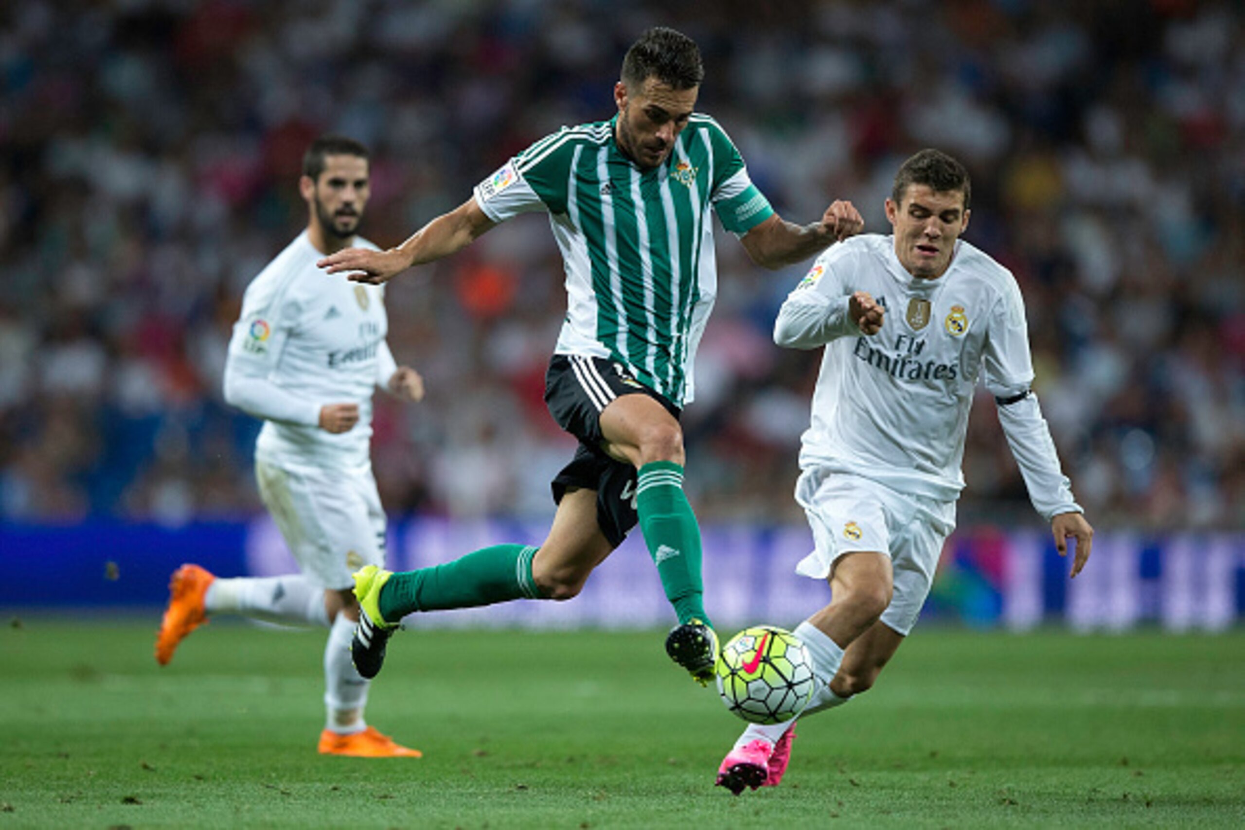 MADRID, SPAIN - AUGUST 29:  Xavi Torres (L) of Real Betis Balompie competes for the ball with Mateo Kovacic (R) during the La Liga match between Real Madrid CF and Real Betis Balompie at Estadio Santiago Bernabeu on August 29, 2015 in Madrid, Spain.  (Pho