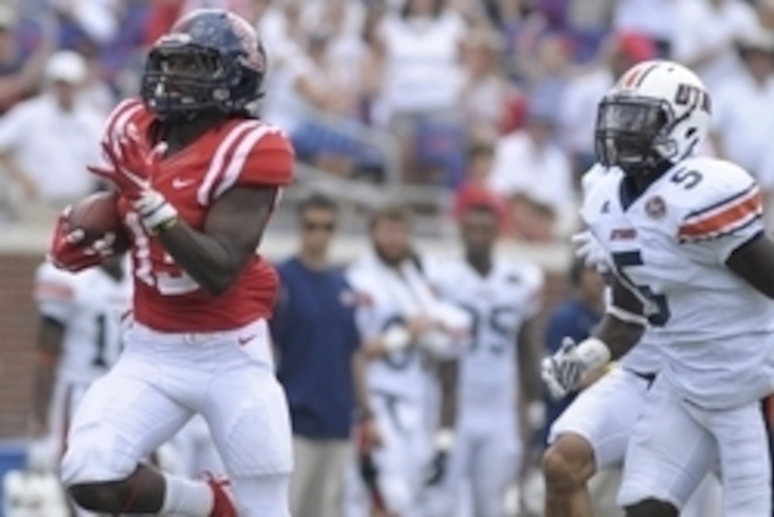 Sep 5, 2015; Oxford, MS, USA; Mississippi Rebels running back Eugene Brazley (13) carries the ball as Tennessee Martin Skyhawks defensive back Rakeem Battle (5) chases at Vaught-Hemingway Stadium. The Rebels won 76 - 3. Mandatory Credit: Justin Ford-USA Sep 5, 2015; Oxford, MS, USA; Mississippi Rebels running back Eugene Brazley (13) carries the ball as Tennessee Martin Skyhawks defensive back Rakeem Battle (5) chases at Vaught-Hemingway Stadium. The Rebels won 76 - 3. Mandatory Credit: Justin Ford-USA