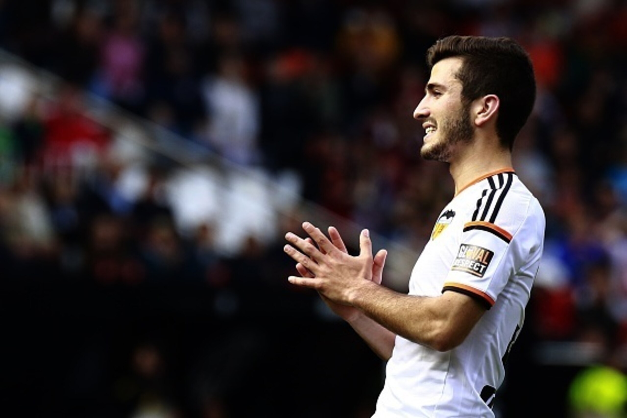 Valencia's defender Jose Gaya joins palms during the Spanish league football match Valencia CF vs Villarreal CF at the Mestalla stadium in Valencia on April 5, 2015.   AFP PHOTO / JOSE JORDAN        (Photo credit should read JOSE JORDAN/AFP/Getty Images)