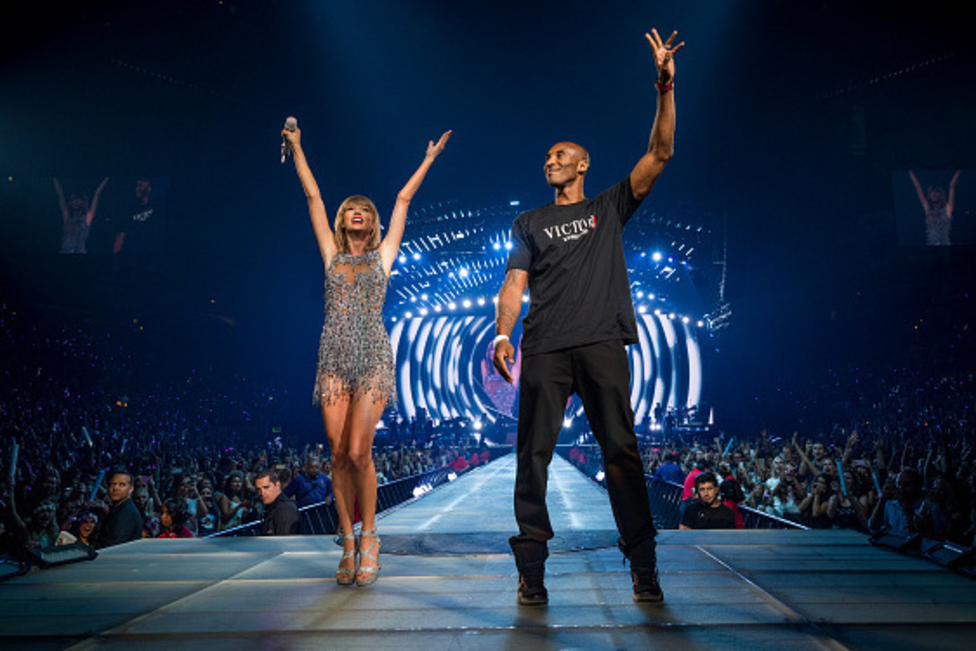 LOS ANGELES, CA - AUGUST 21: Singer-songwriter Taylor Swift (L) and NBA player Kobe Bryant speak onstage during The 1989 World Tour Live In Los Angeles at Staples Center on August 21, 2015 in Los Angeles, California. (Photo by Christopher Polk/Getty Ima LOS ANGELES, CA - AUGUST 21: Singer-songwriter Taylor Swift (L) and NBA player Kobe Bryant speak onstage during The 1989 World Tour Live In Los Angeles at Staples Center on August 21, 2015 in Los Angeles, California. (Photo by Christopher Polk/Getty Ima