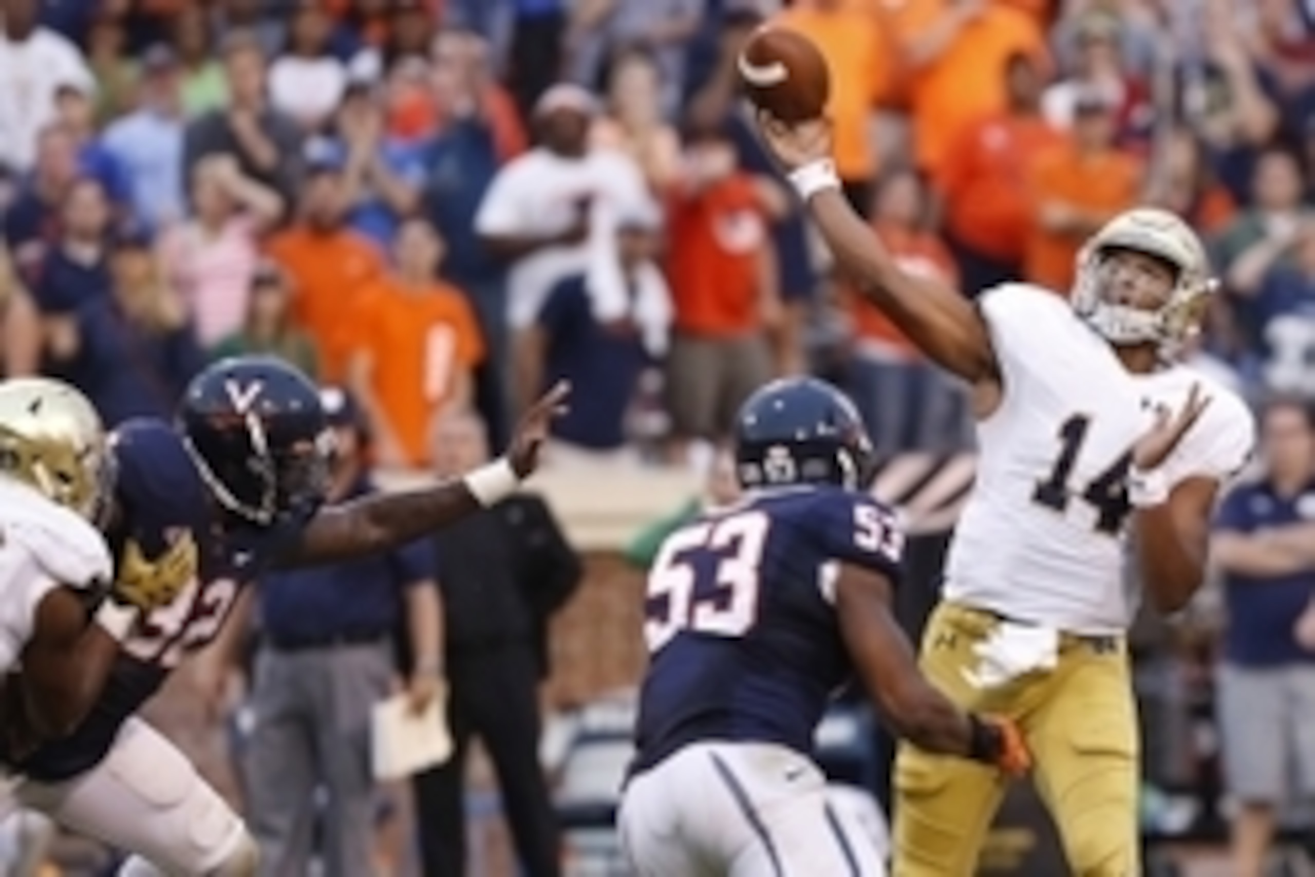 Sep 12, 2015; Charlottesville, VA, USA; Notre Dame Fighting Irish quarterback DeShone Kizer (14) throws the game-winning touchdown pass over Virginia Cavaliers linebacker Micah Kiser (53) with twelve seconds left in the fourth quarter at Scott Stadium. Th