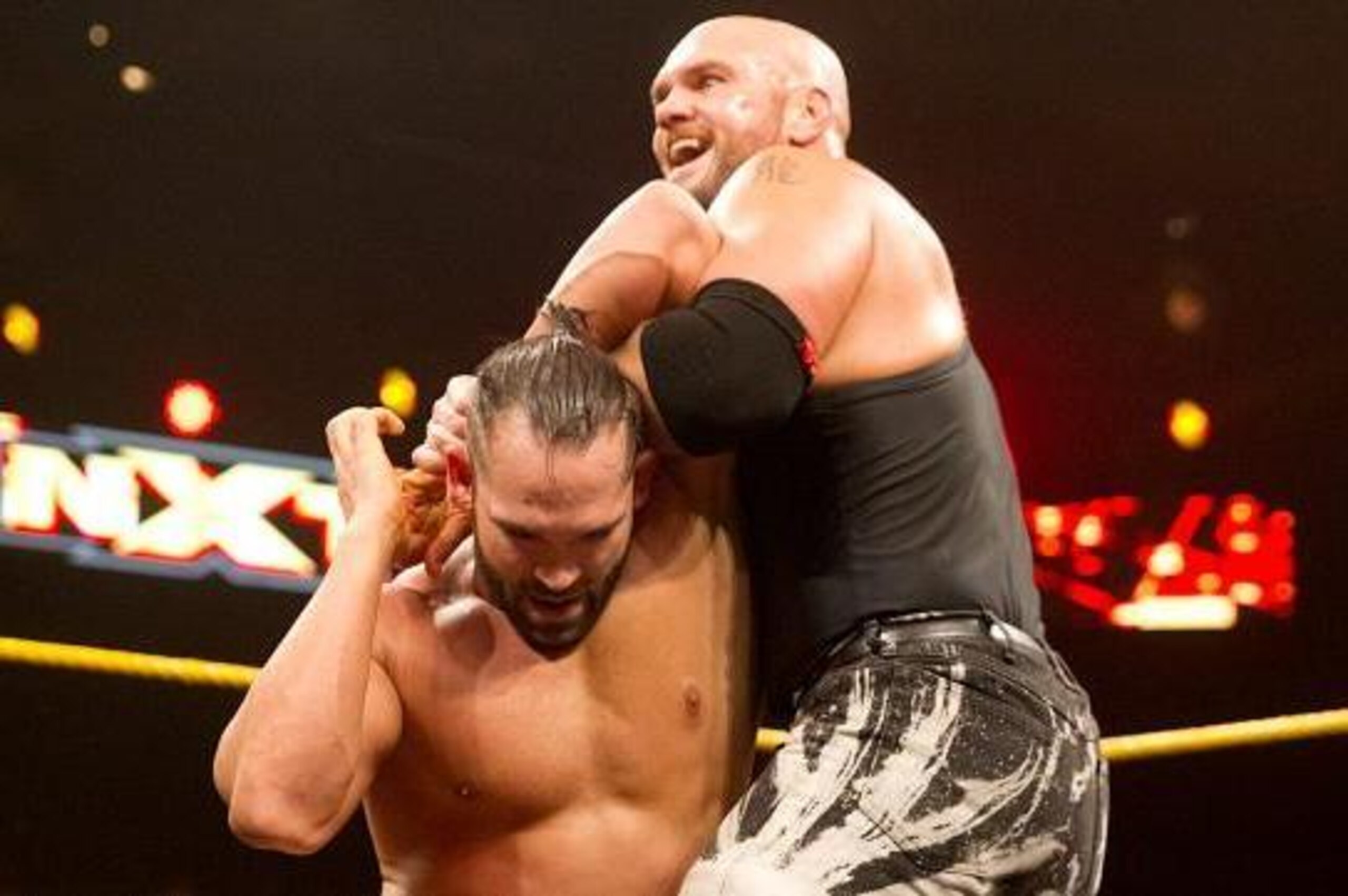 Tye Dillinger looks to escape from Martin Stone's grip.